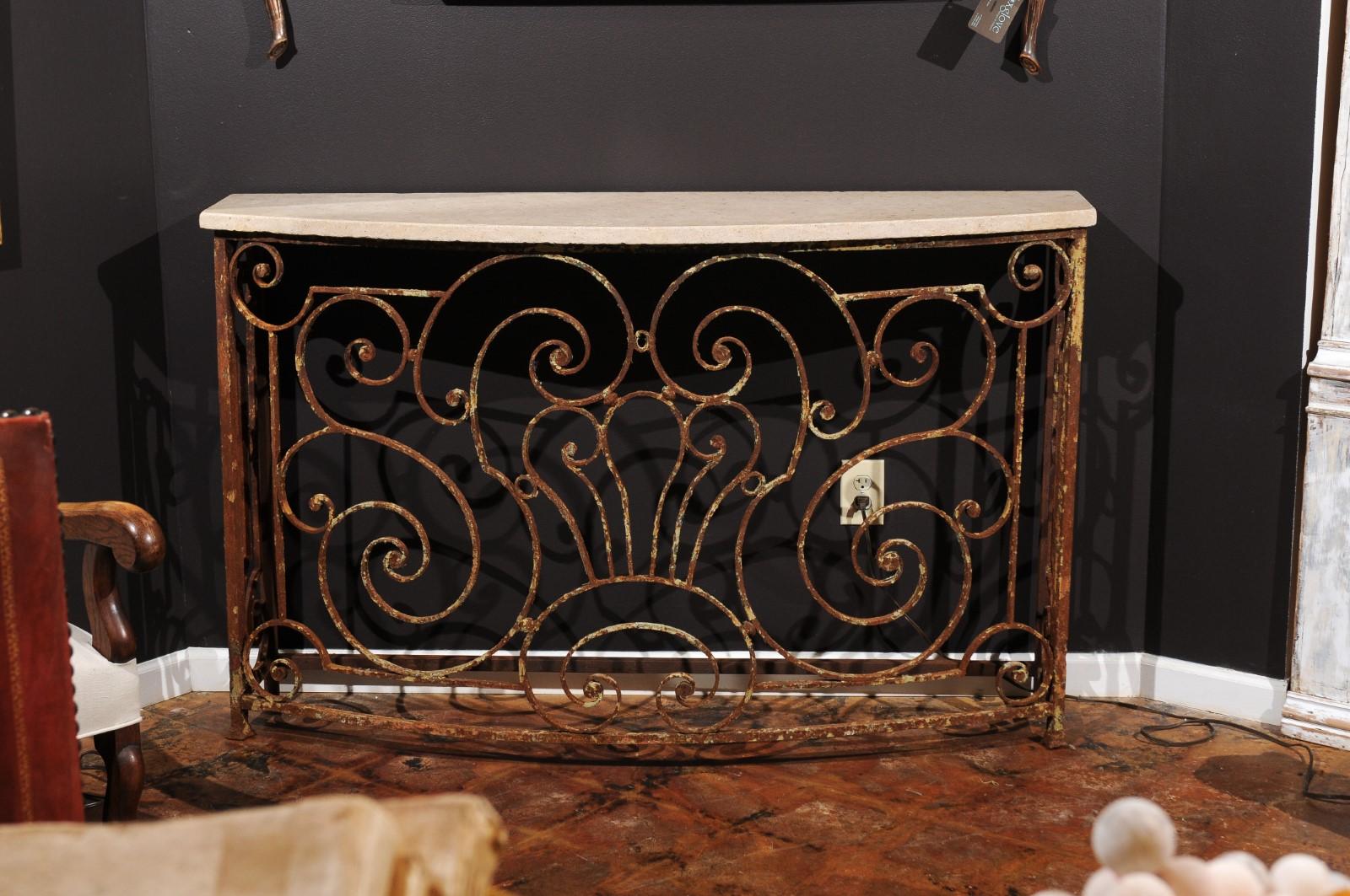 A French Parisian balcony rail from the late 19th century, converted into a console table with a new custom stone top. We currently have ONE console. This console table features a rectangular stone top with convex front that was custom made to