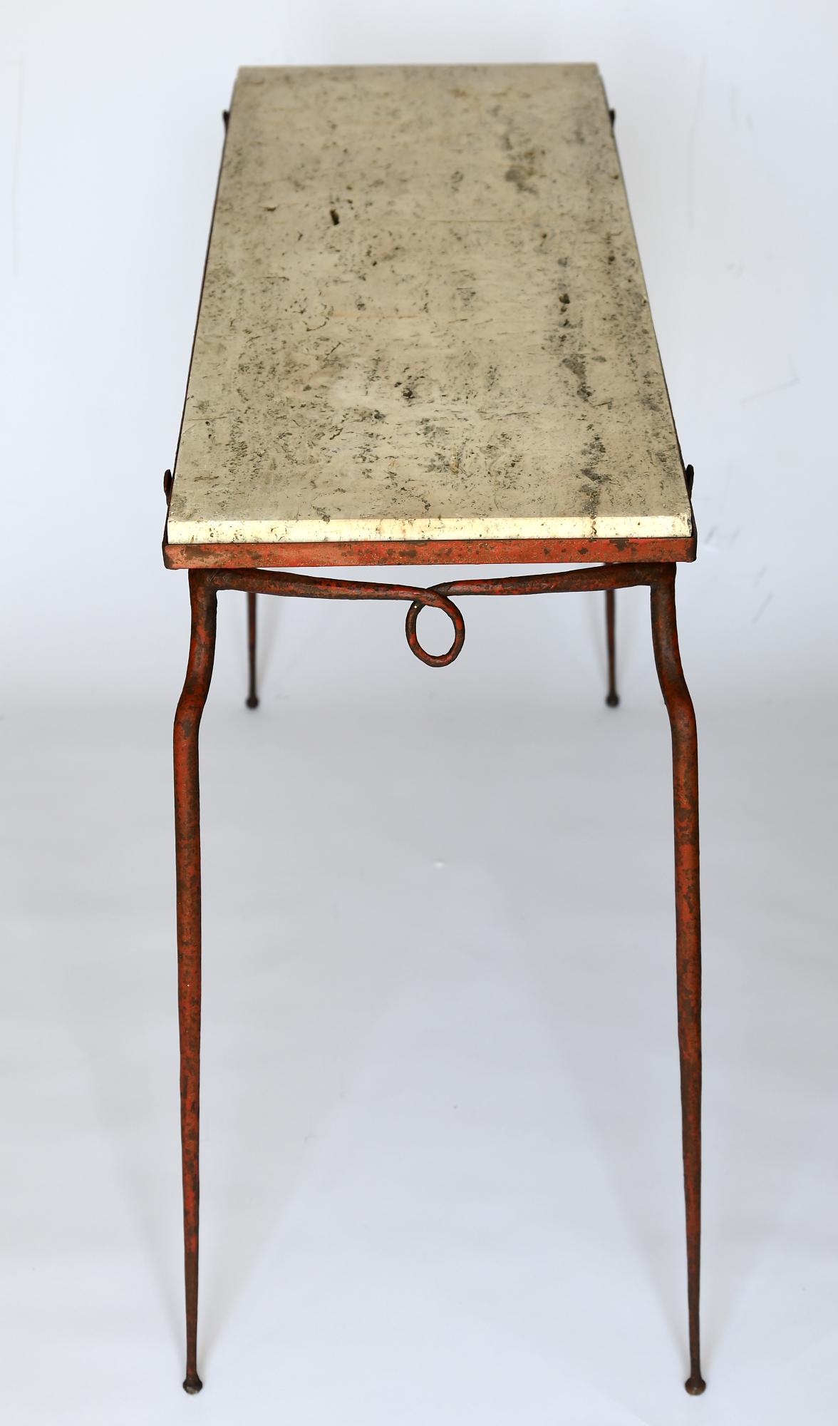 The console table attributed to Rene Prou, France 1930s
Iron with its original red color and an travertine plate
Very fine and elegant iron furniture, which emphasizes its charm through the thin legs
The furniture can also be placed freely.