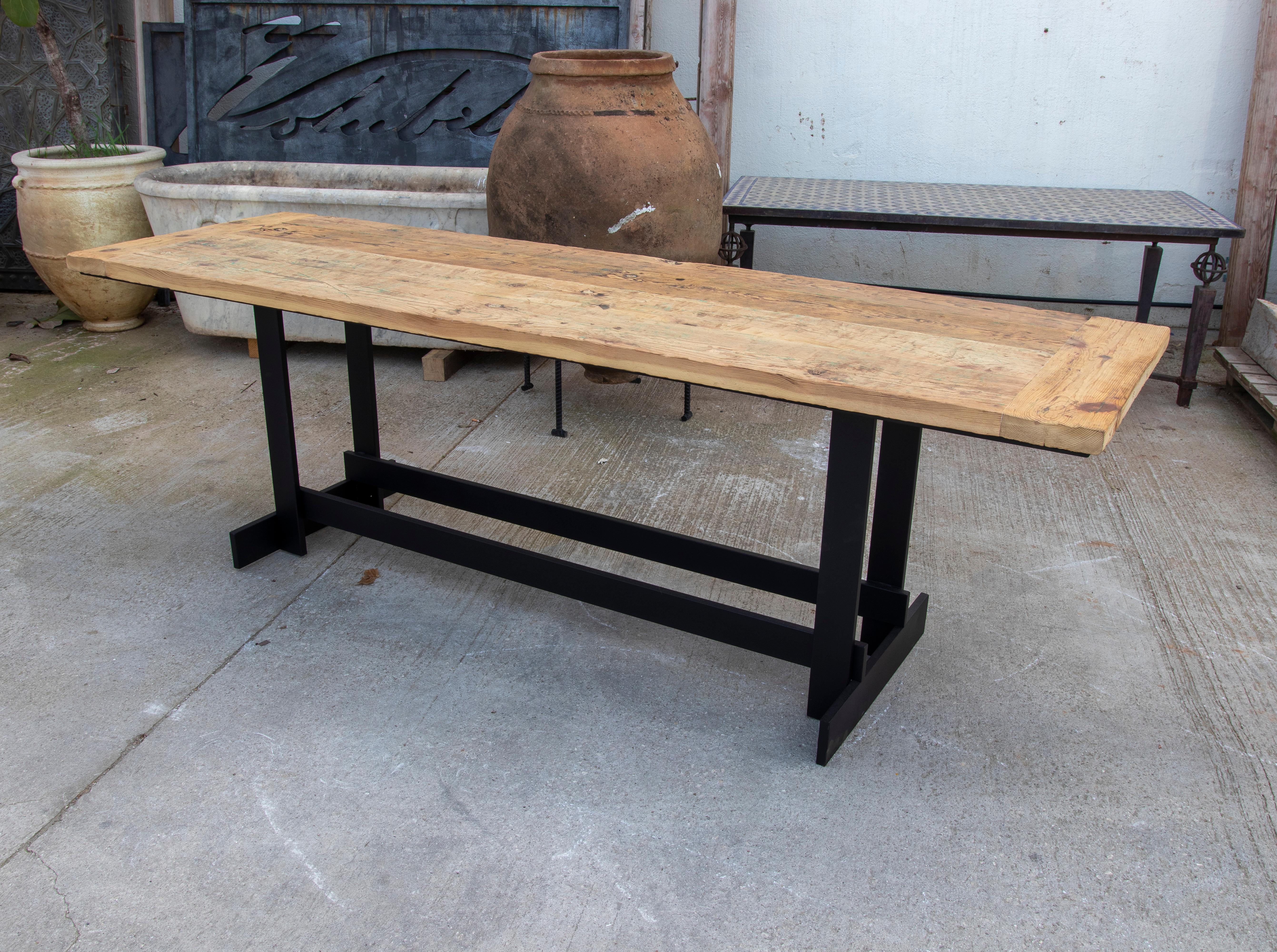 Spanish Console Table with Iron Base and Rustic Wooden Table Top For Sale