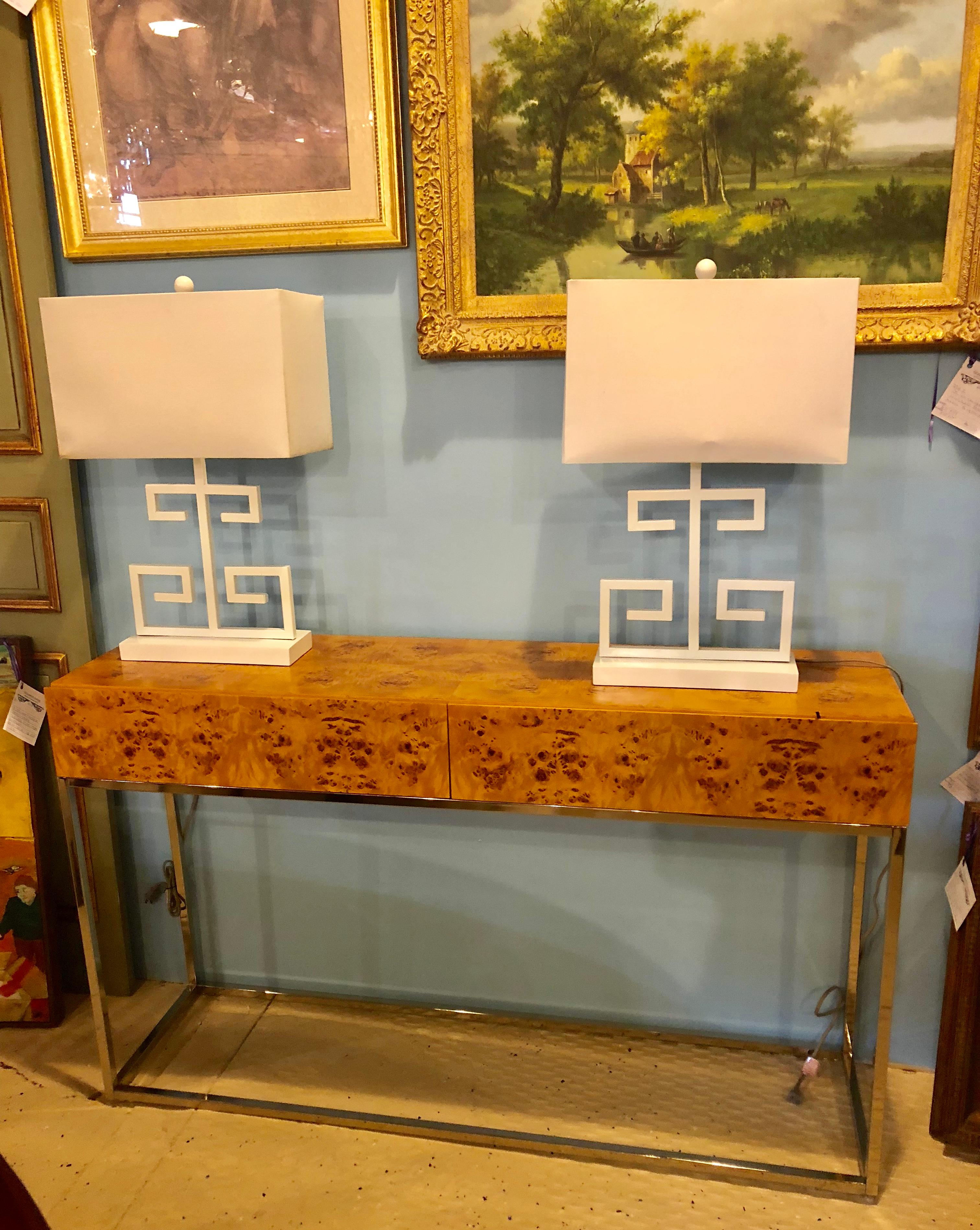 Finely constructed Milo Baughman style console table with nice burl grain having two drawers on a chrome base. A sleek and stylish console or sofa table that is certain to resonate with the era and setting that it is made for.