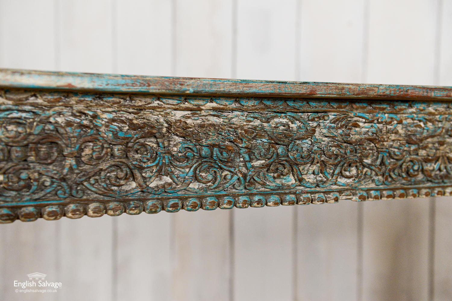 Teak console tables made from reclaimed carvings. Both tables are the same measurements but have different designs. Good solid tables with a distressed painted finish. More bluish one sold.
