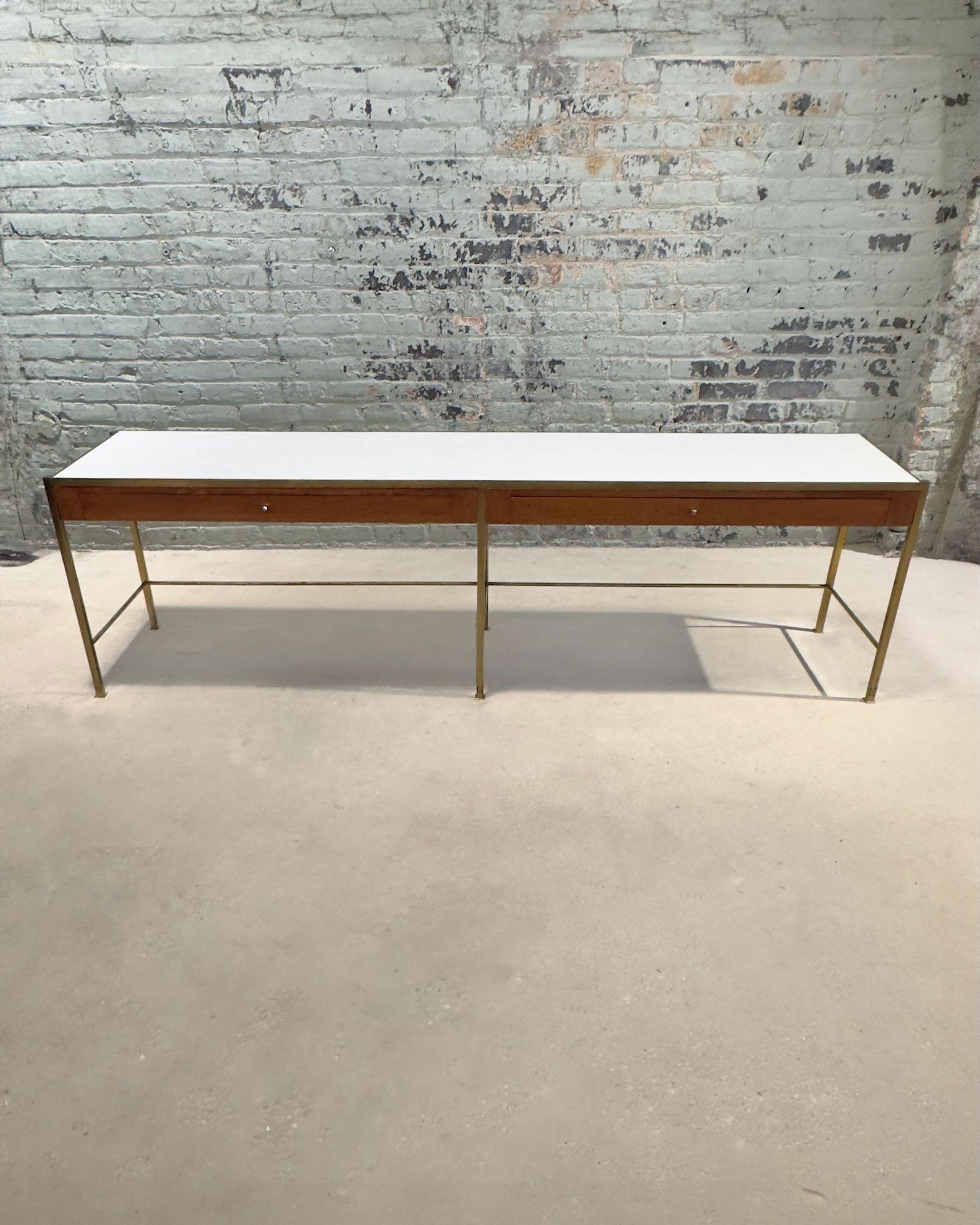 Mid Century Modern Console w/Vitrolite Glass and Brass Style of Paul McCobb, 1960. As shown in pics the Vitrolite glass had broken on the corner, but has been repaired. Does not take away from the beauty of this unusual piece. Brass has a beautiful