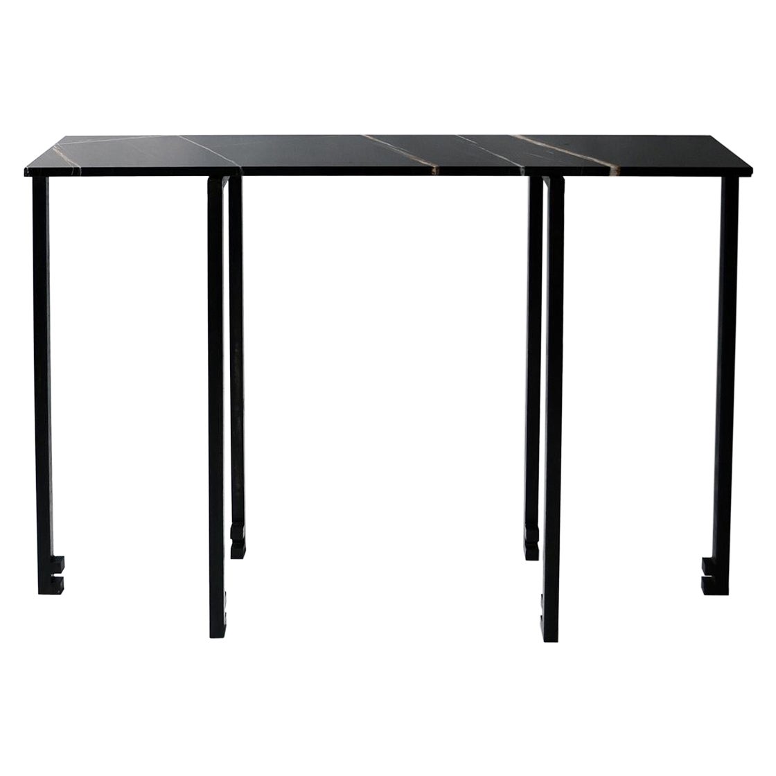 Console No. 1
J.M. Szymanski
d. 2018

This unique console table is inspired by the ancient Asian decorative arts. The inverted legs give this unique table a highly dynamic look. Its slender structure supports a gorgeous slab of ¾