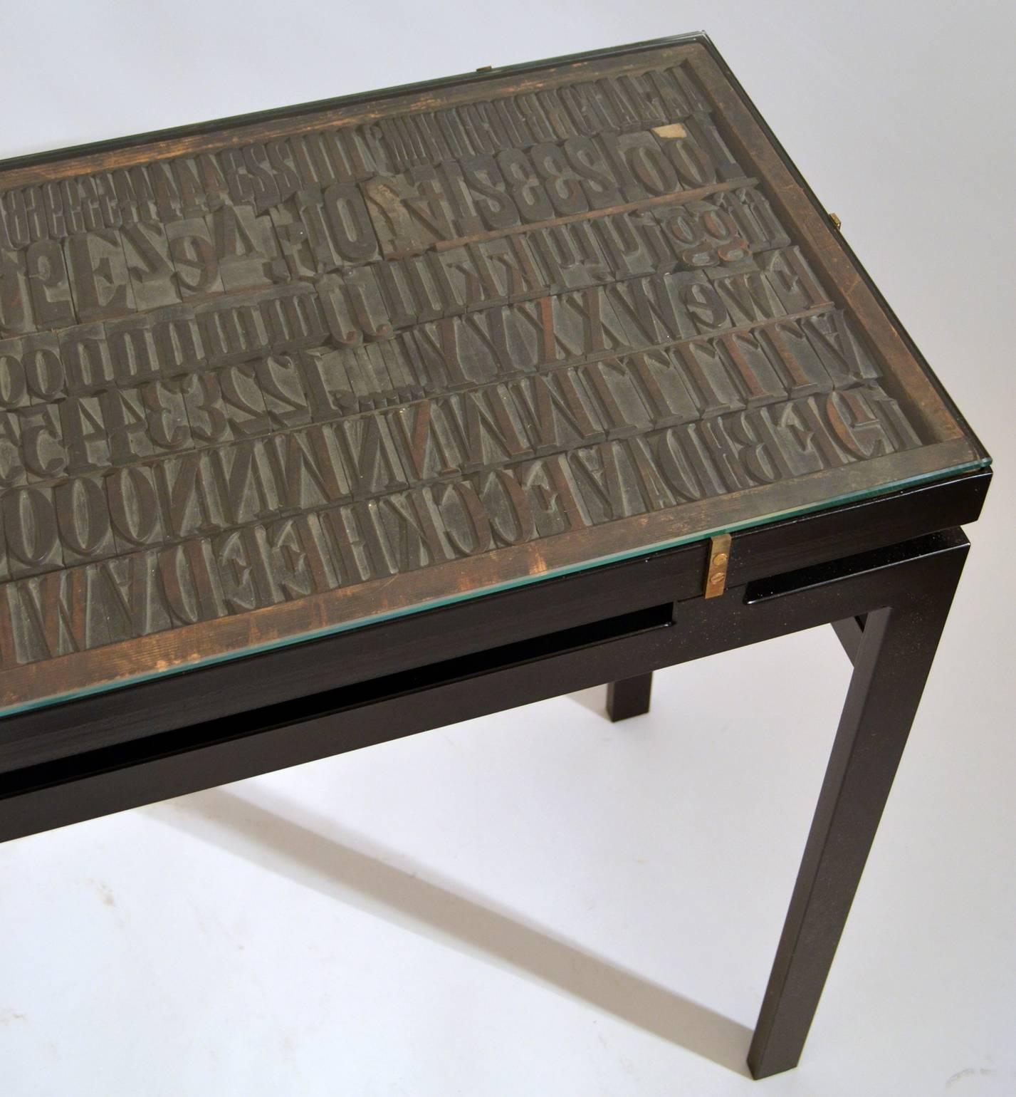 Modern Console with Antique Printing Letters and Glass Top on Metal Frame For Sale