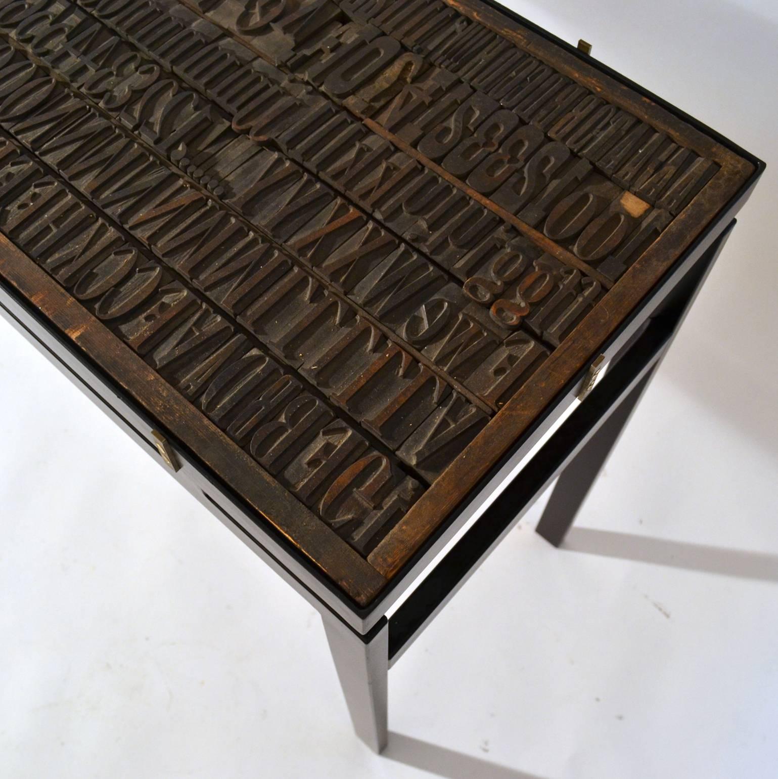Contemporary Console with Antique Printing Letters and Glass Top on Metal Frame For Sale