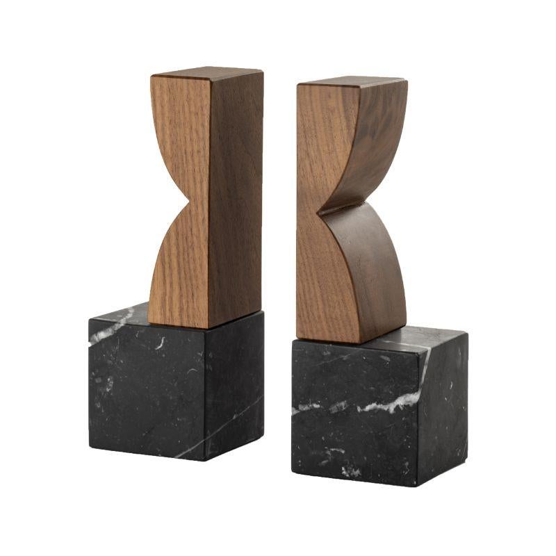 Constantin Bookends by Colé Italia, C with Agustina Bottoni
Dimensions: H.20 D.7 W.7 cm
Materials: The body is a cube in Marquina black marble with white veins. The top is in solid Canaletto walnut.

Also Available: a - solid brushed oak black
