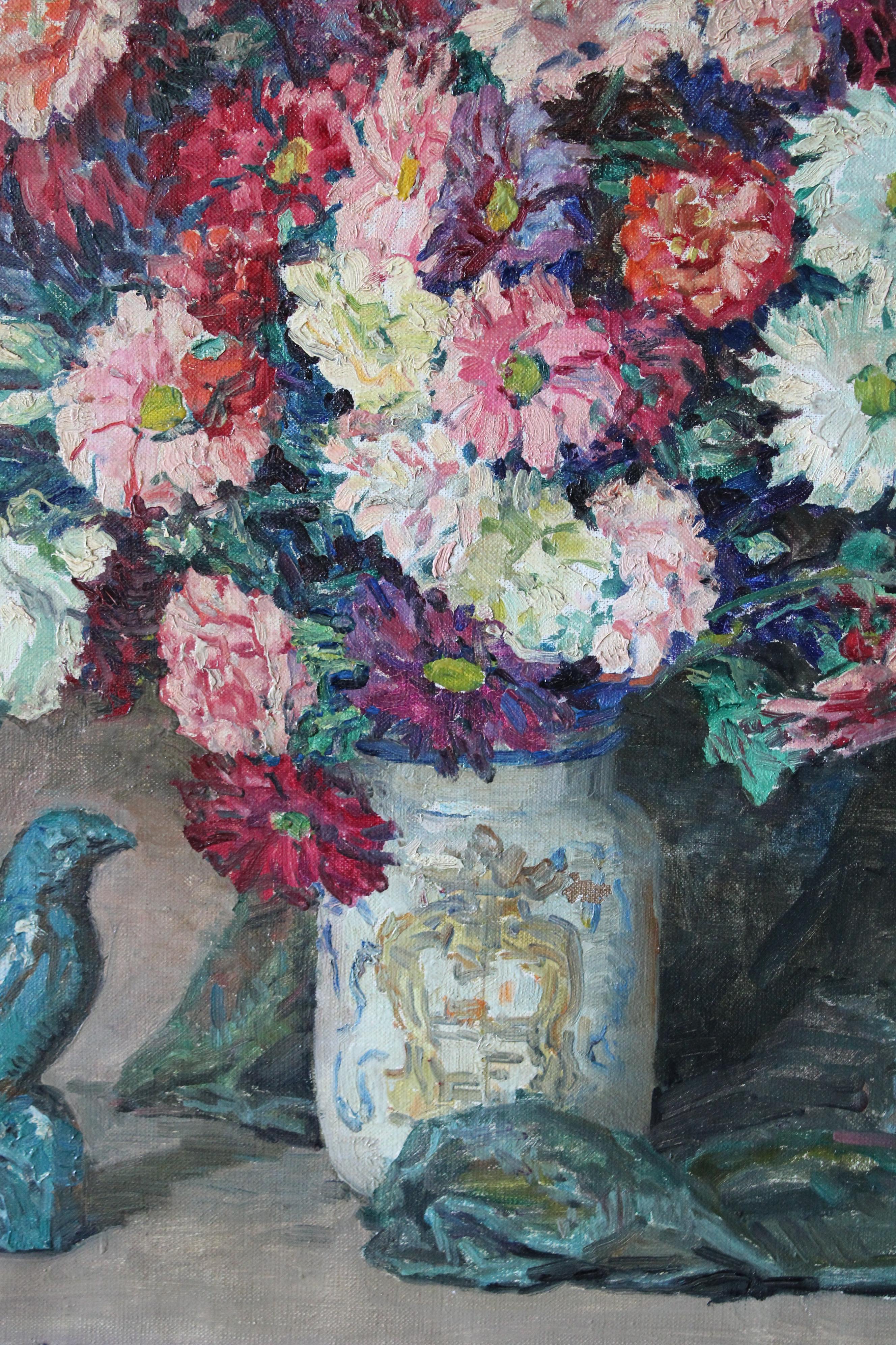 Large still life oil painting by French artist, Constantin Font signed in the lower left.  This very attractive oil on canvas hails from the 1930's.   A  composition that is perfection, flowers crammed and arranged not too neatly in an attractive