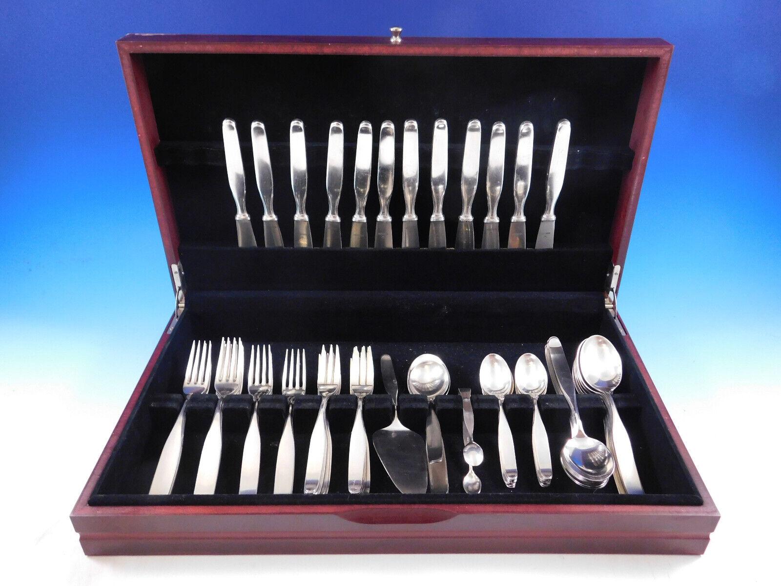 Constanze By Wilkens German 800 Silver Flatware set with modern unadorned design - 64 pieces. This set includes:

12 Knives, 7 7/8