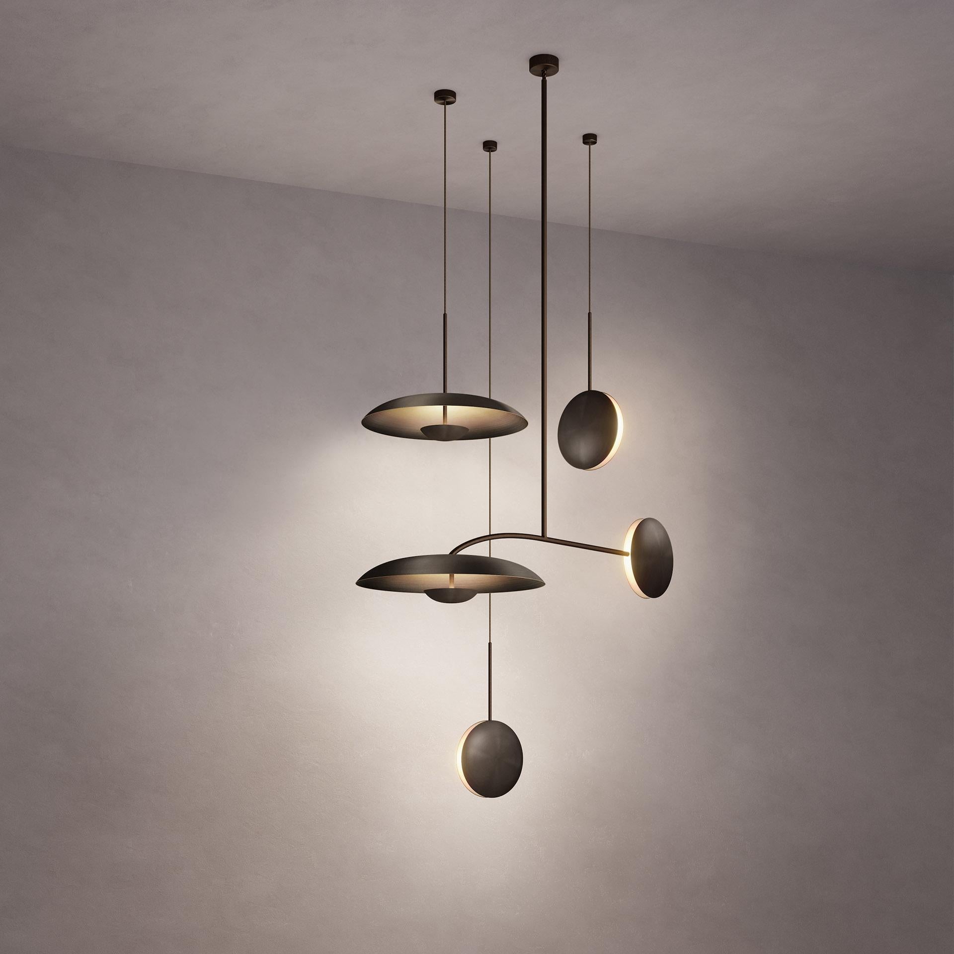 Inspired by planet-like shapes and textures, the Cosmic collection plays with both metal properties and a selection of patina finishes.
 
Named after the natural dark rock material Regolith, the four lighting components are harmoniously balanced to