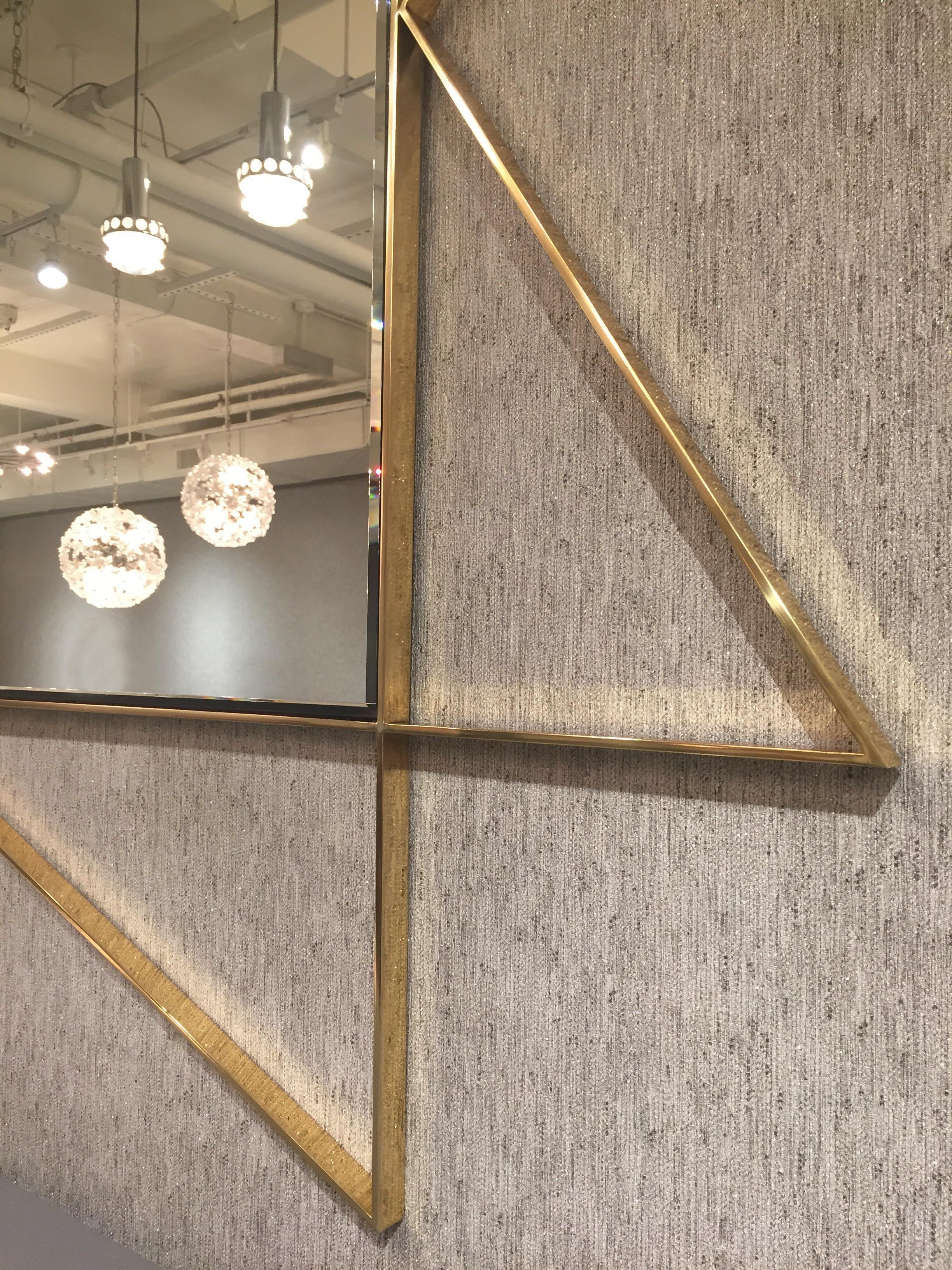 The Constellation mirror, designed by Irwin Feld Design for CF Modern, is a large beveled mirror with a distinctive solid brass frame. The outer portion of the frame is left open to show the chic brass against your wall. 

CF Moderrn merchandise