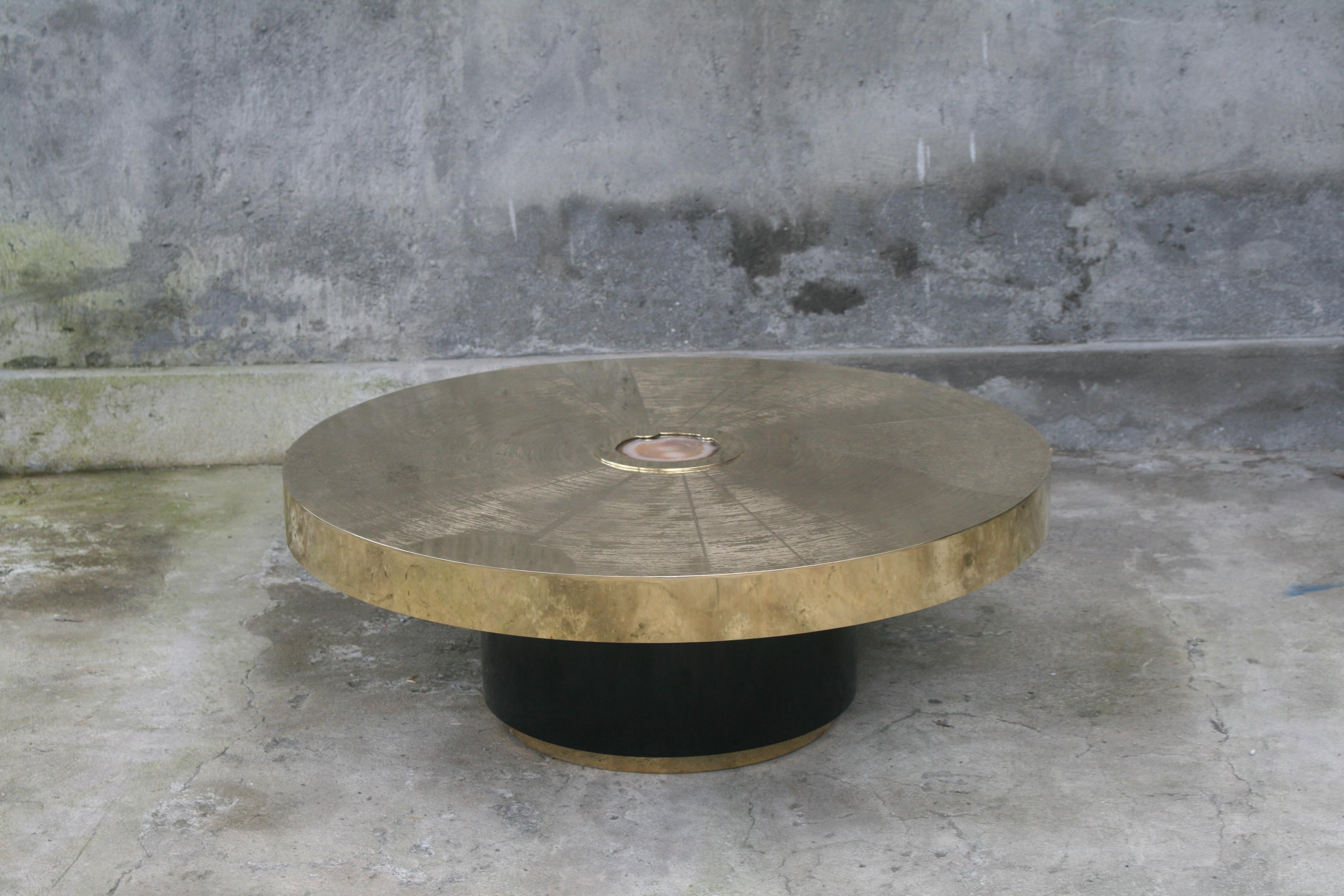 Studio Belgali is a Belgian producer of brass handmade furniture. Mostly acid etched design, finished with high quality rare semi precious gems. 

Round Star Trek coffee table with agate stone slice inlay. It has been acid etched and black