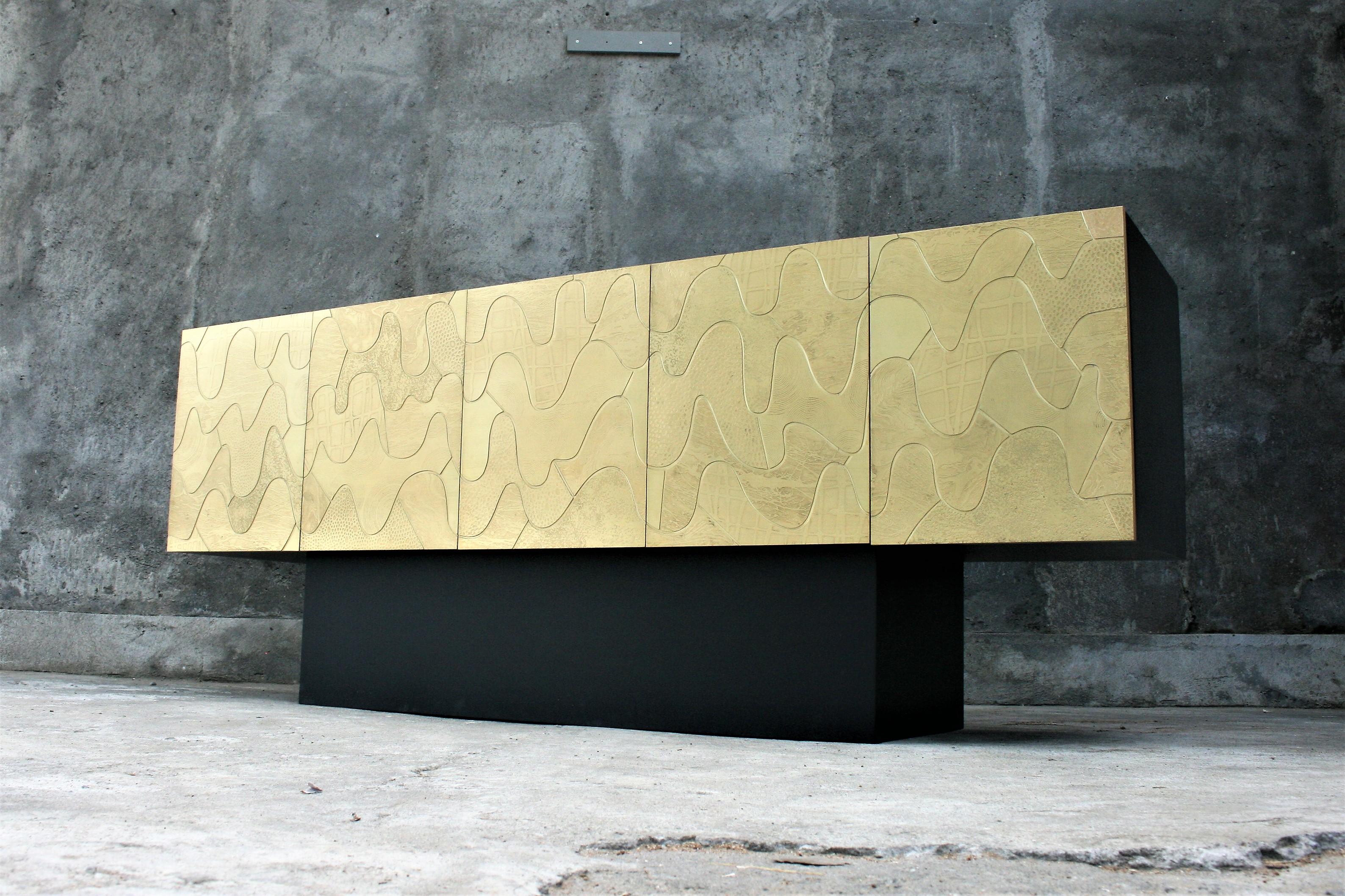 5-door cabinet by Belgian artist Felix de Boussy for studio Belgali. Acid etched door panels and black lacquered corpus. Unique piece of art.

We can make all furniture in acid etched brass with or without semi precious jewels.




