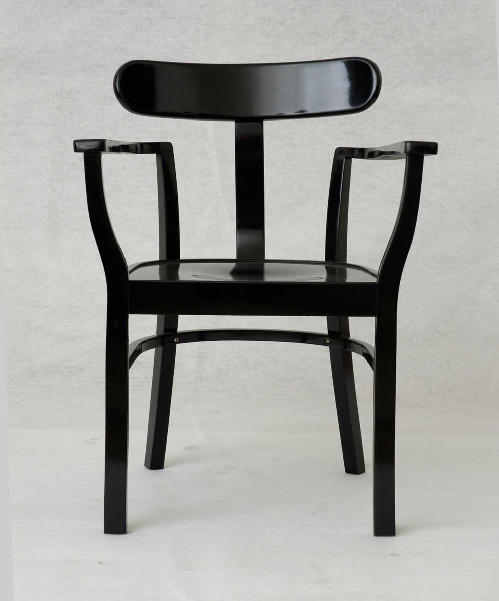 Ebonized and polished steamed, bent beechwood. The chair was produced by Josef Heisler chair and wooden products company, Budapest in early 1930s. 
Reference: 100 Years of Hungarian Furniture by Jozsef Vadasz, 1992.
The new house - modern villas