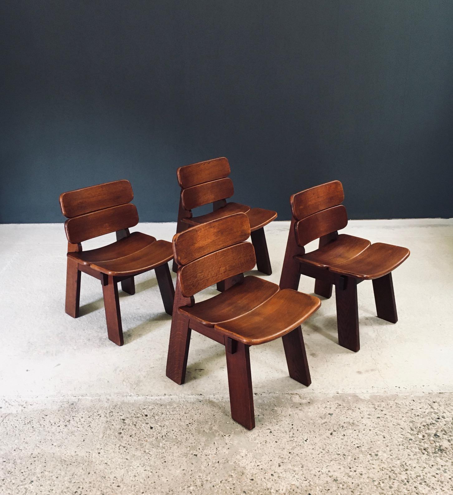 Vintage Constructivist / Brutalist Design Oak Dining Chair set of 4. Made in Belgium, 1960's period. Heavy solid oak constructed Chairs with beautiful construction details. These come in very good, original condition with normal wear from their age