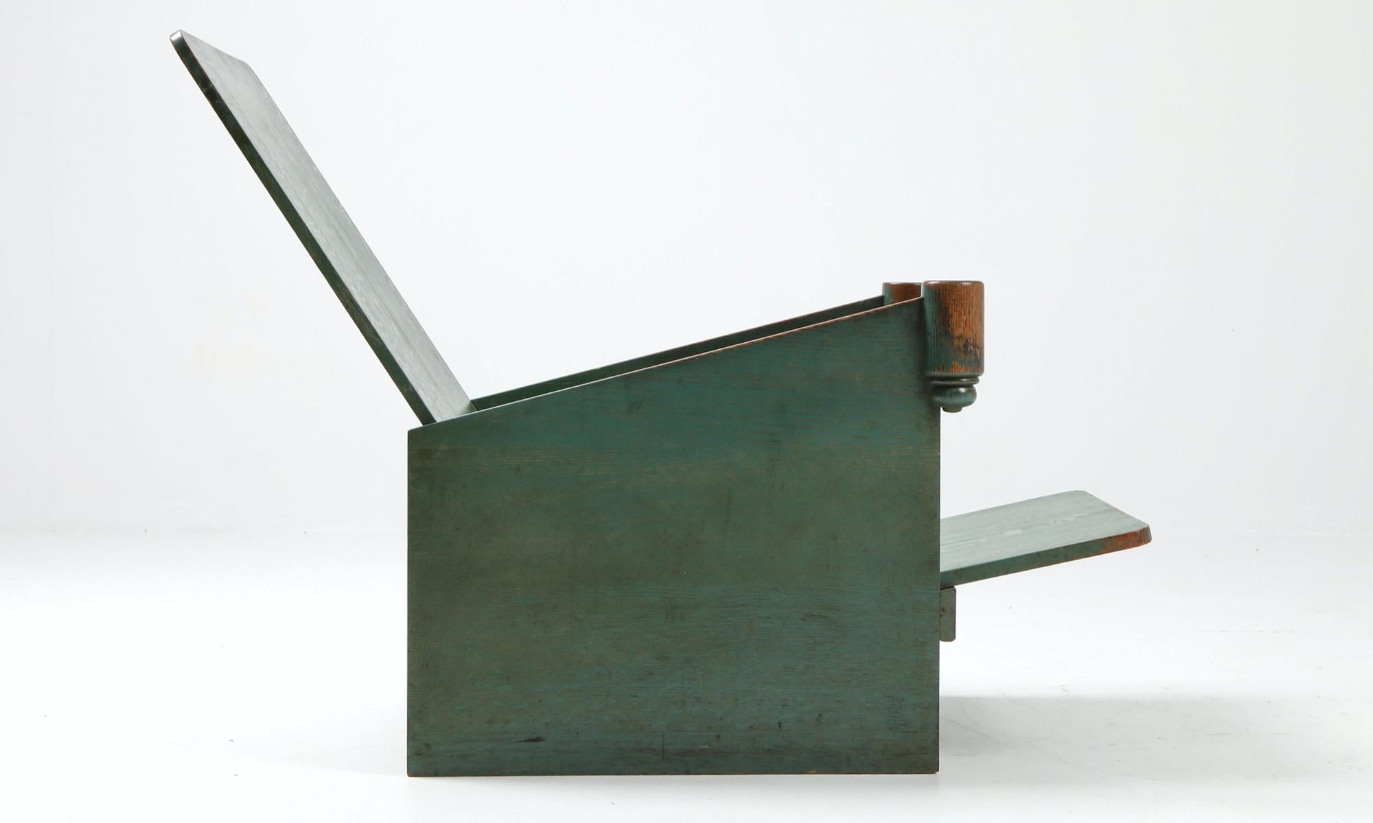 Modernist patinated oak lounge chairs attributed to Huib Hoste and Karel Maes.

 
