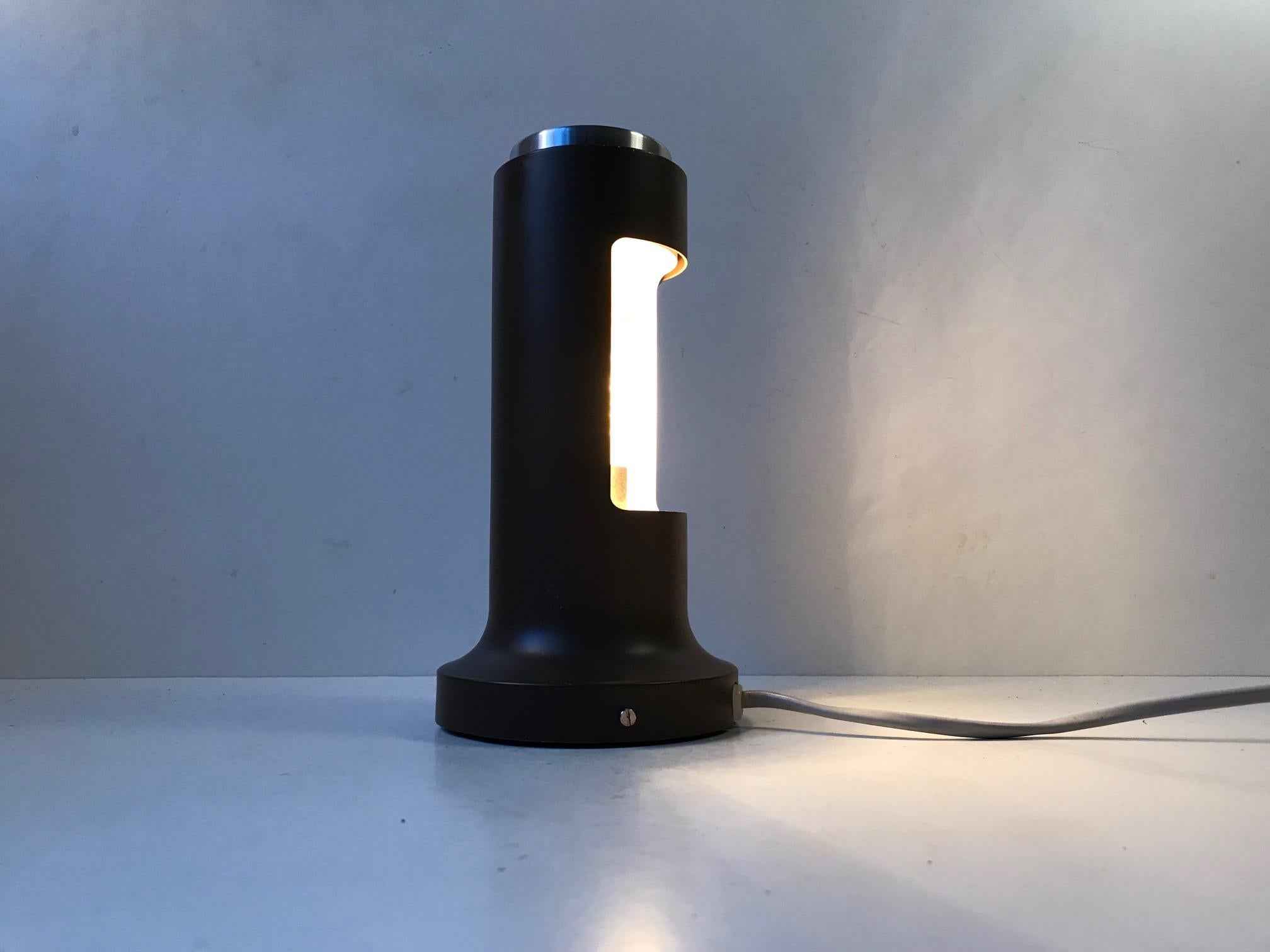 This hybrid wall or table lamp, model Contact, was designed by Peter Avondoglio during the 1970s and manufactured by Fog & Mørup, Denmark. The design has won international awards. It features a jumbo switch that also adjusts the light direction of