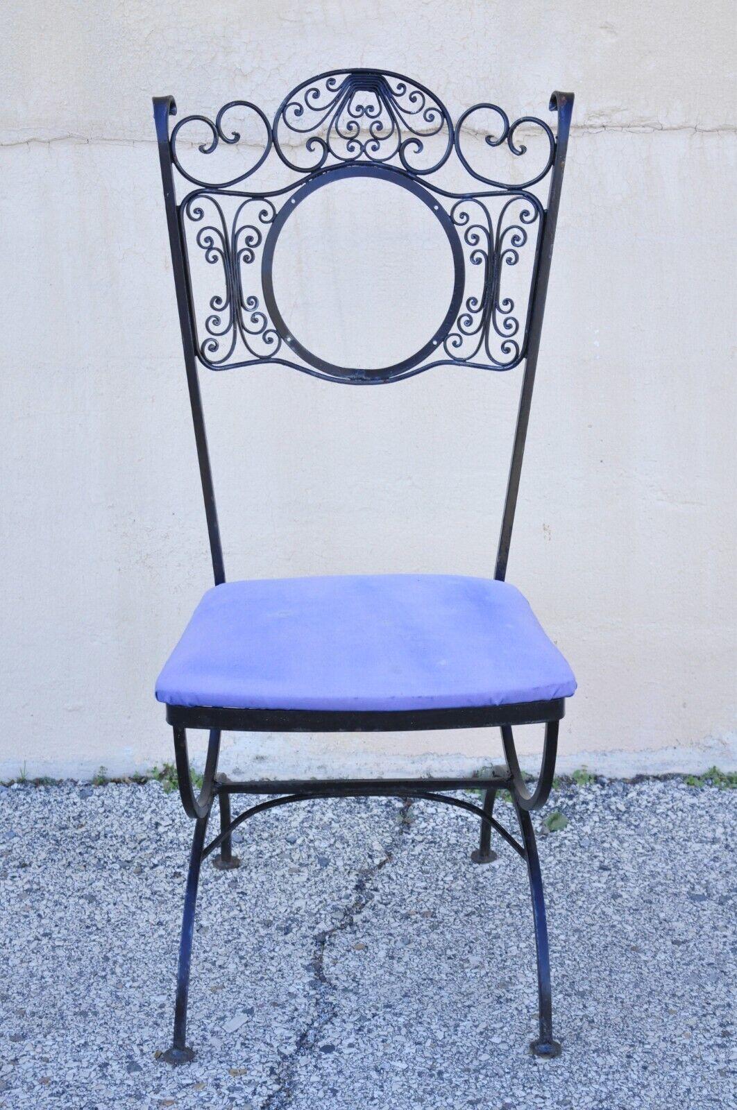 Contempo Vintage Woodard Andalusion style wrought iron dining chairs - set of 4. Item features (4) chairs, wrought iron scrolling frames, curule form bases, round back rest (missing upholstered panel), very nice vintage set, great style and form.