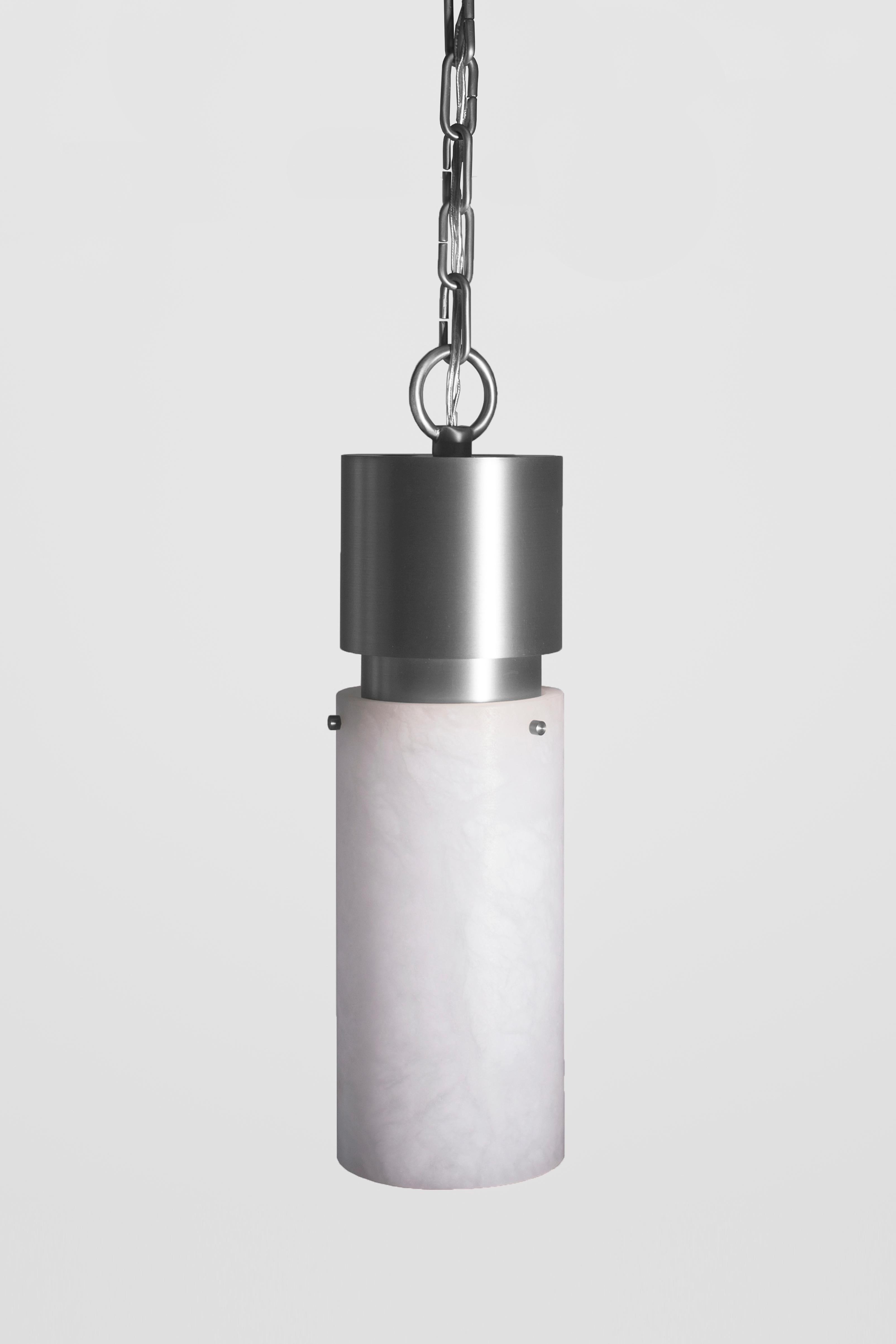 Orphan Work 000 Pendant
Shown in brushed nickel and alabaster
Available in brushed brass, brushed nickel and blackened brass
Measures: 15 1/4” height x 5 3/8” diameter
Includes 3' of chain
UL approved
Holds (1) 60w candelabra bulb
must use LED