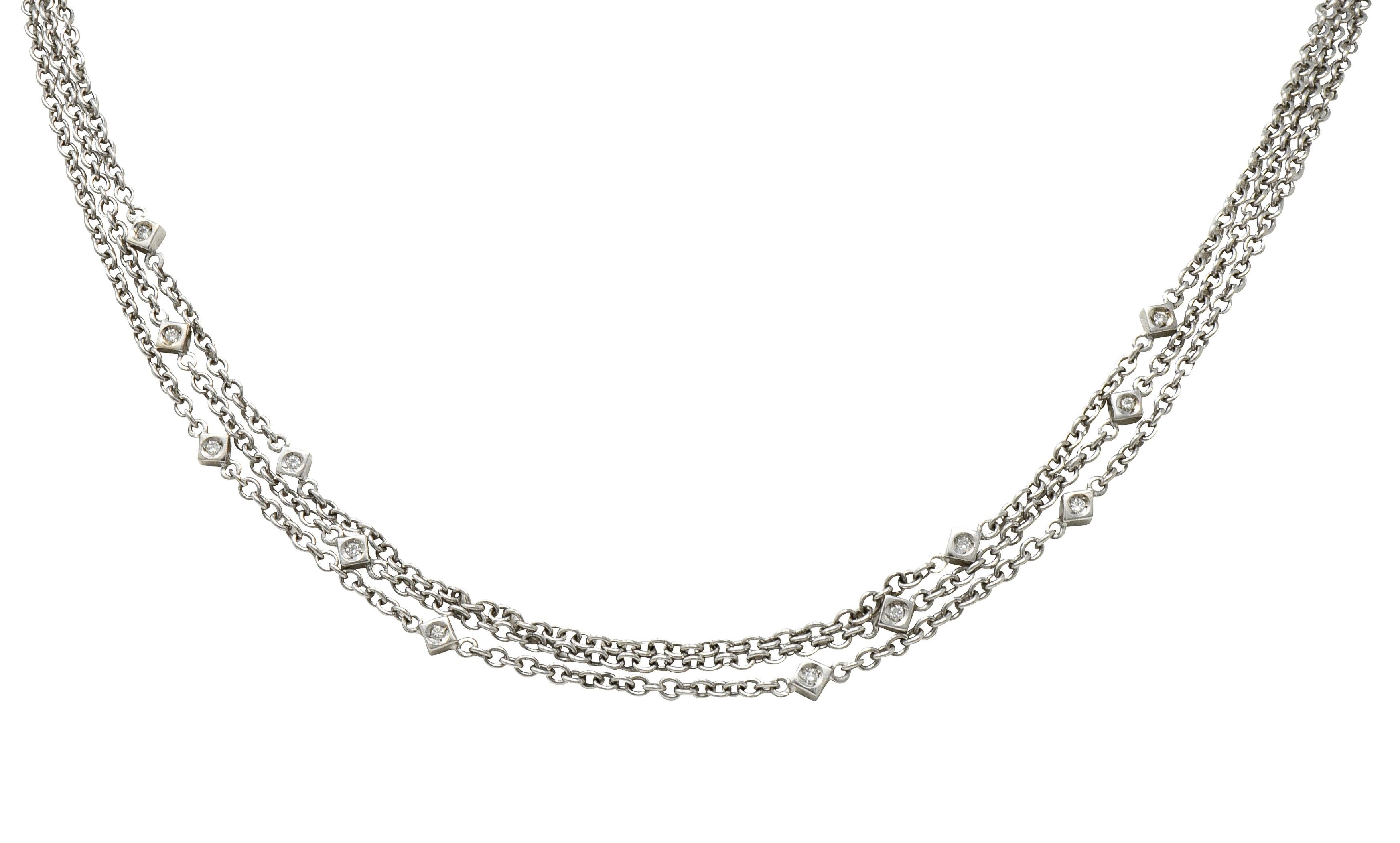 Necklace is comprised of three swagged cable chain strands

Interspersed with navette forms accented by round brilliant cut diamonds; double sided

Weighing in total approximately 0.50 carat with G/H color and SI clarity

Completed by lobster