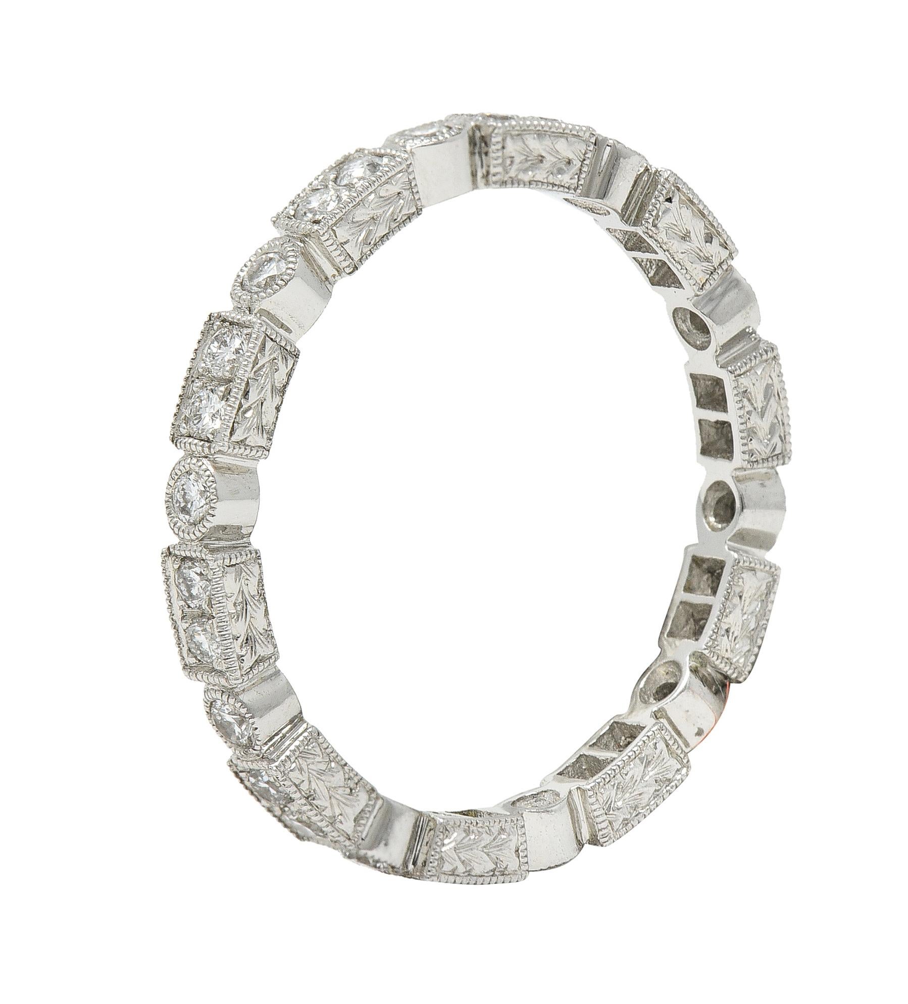 Eternity band ring is designed as a geometric pattern with milgrain
Rectangular forms alternate with circular forms while accented by round brilliant cut diamonds
Weighing in total approximately 0.50 carat with G/H color and VS clarity
Completed by