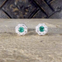 Contemporary 0.50 Carat Emerald and Diamond Cluster Earrings in 18 Carat Gold