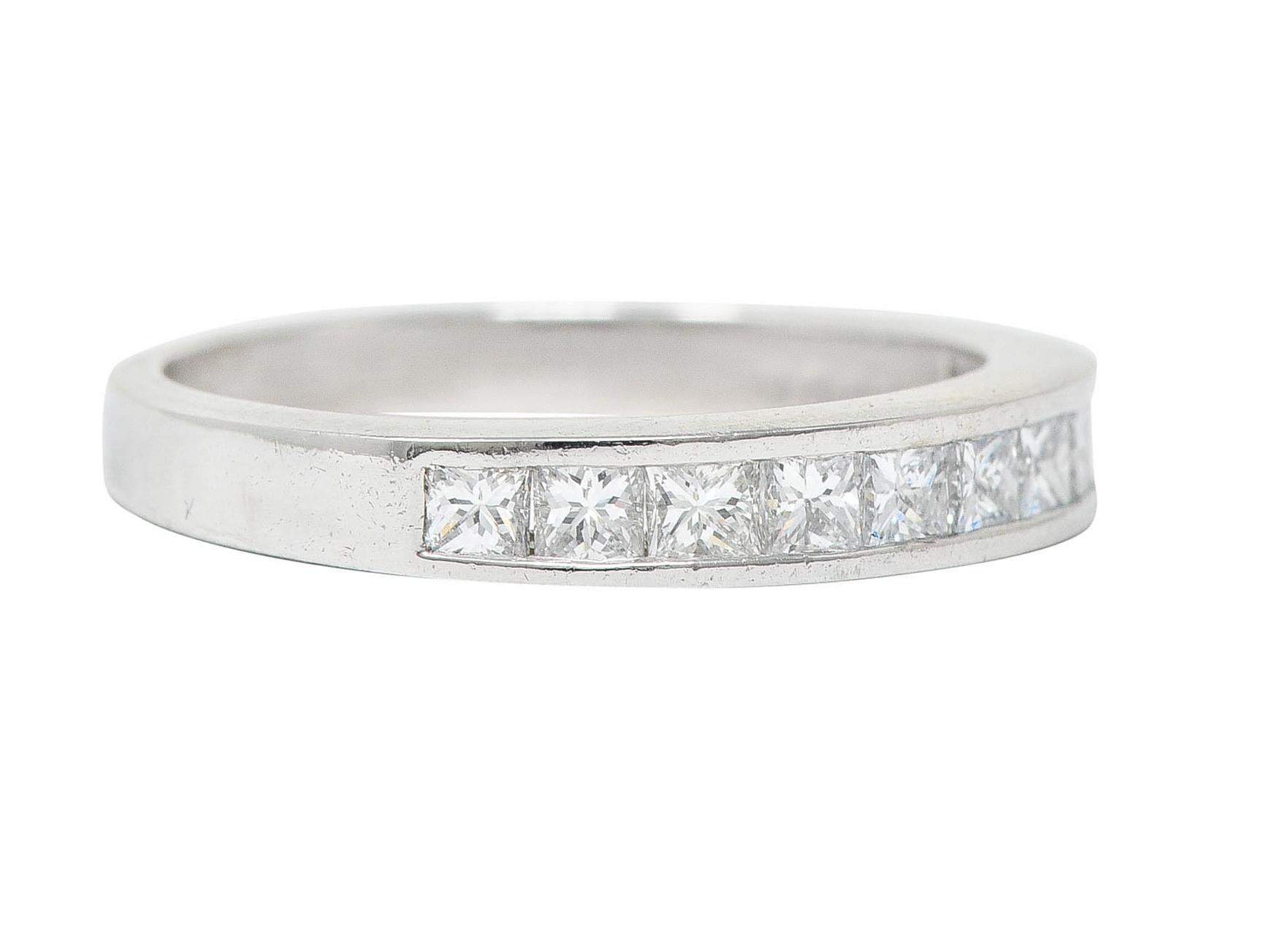 Band ring is channel set to front by graduating princess cut diamonds

Weighing approximately 0.55 carat in total - G/H in color with VS clarity

Numbered and stamped PT950 for platinum

Circa: 2000's

Ring size: 5 and sizable

Measures: North to