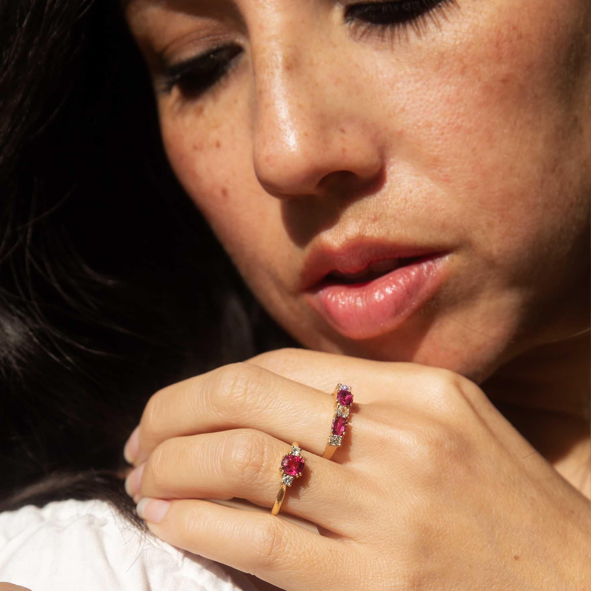 Our Tulia Ring, crafted in 18 carat yellow gold with a vibrant pink tourmaline reminiscent of summer sunsets and two diamonds adding ice to her fire. This is not merely a ring - it is a wearable heirloom, a treasure to be cherished for