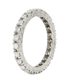 Contemporary 0.72 CTW Diamond Platinum Scrolling Dollar Zeichen Eternity Band Ring