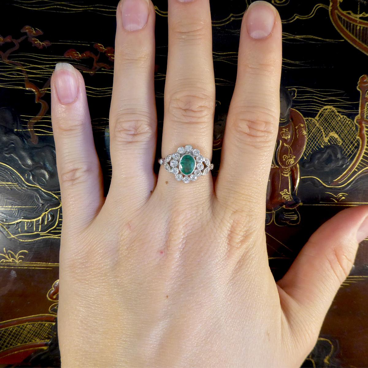Contemporary 0.75ct Emerald and Diamond Cluster Ring with Shoulders in Platinum 1