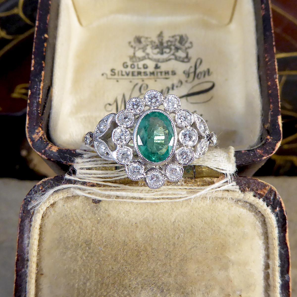 Contemporary 0.75ct Emerald and Diamond Cluster Ring with Shoulders in Platinum 2
