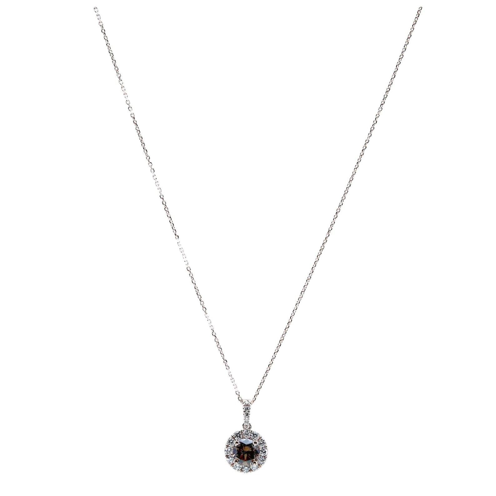 A fancy champagne diamond halo style pendant in 14 karat rose gold.

Set with a 0.70 carat natural fancy champagne color center diamond of VS2 clarity.

Encircled and accented by 0.27 carats of G color VS2 clarity round brilliant cut