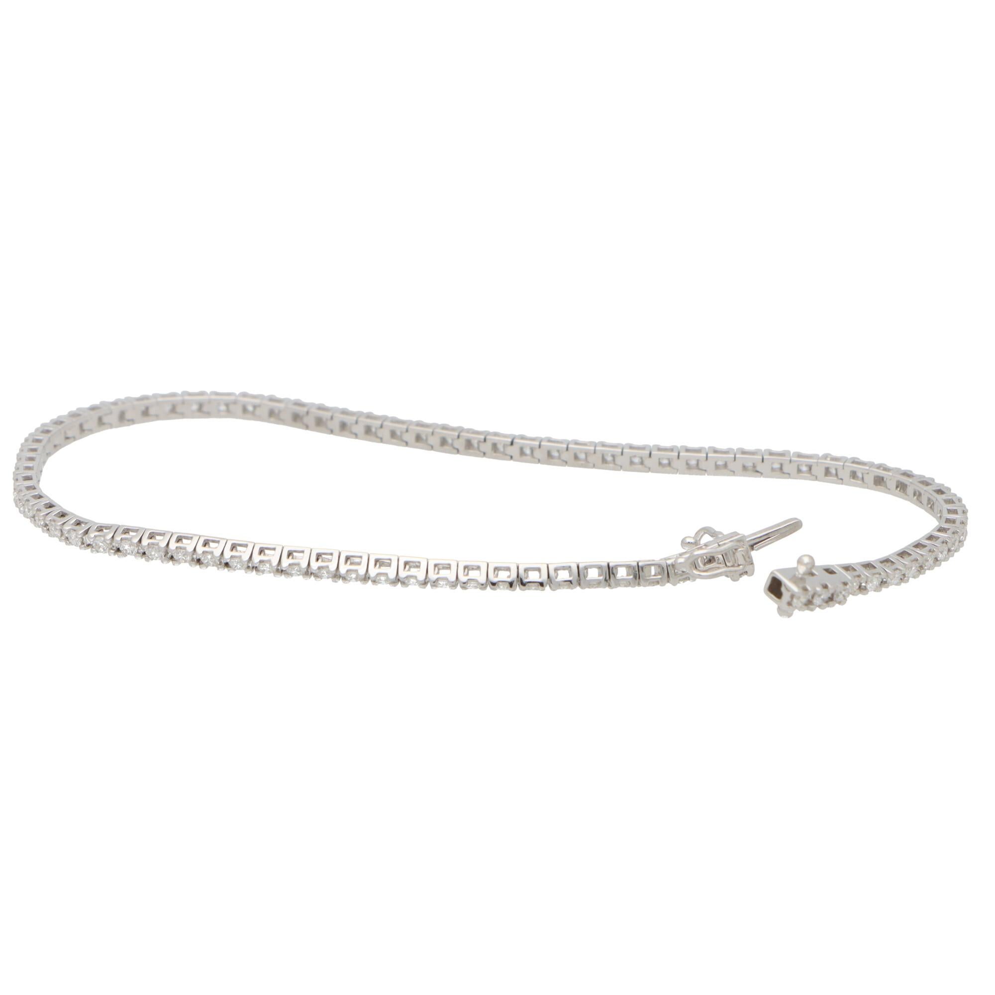  A lovely contemporary diamond line bracelet set in 18k white gold.

The bracelet is composed of a grand total of 83 round brilliant cut sparkly diamonds, all of which are claw set securely. 

Due to the links being articulated, this allows the