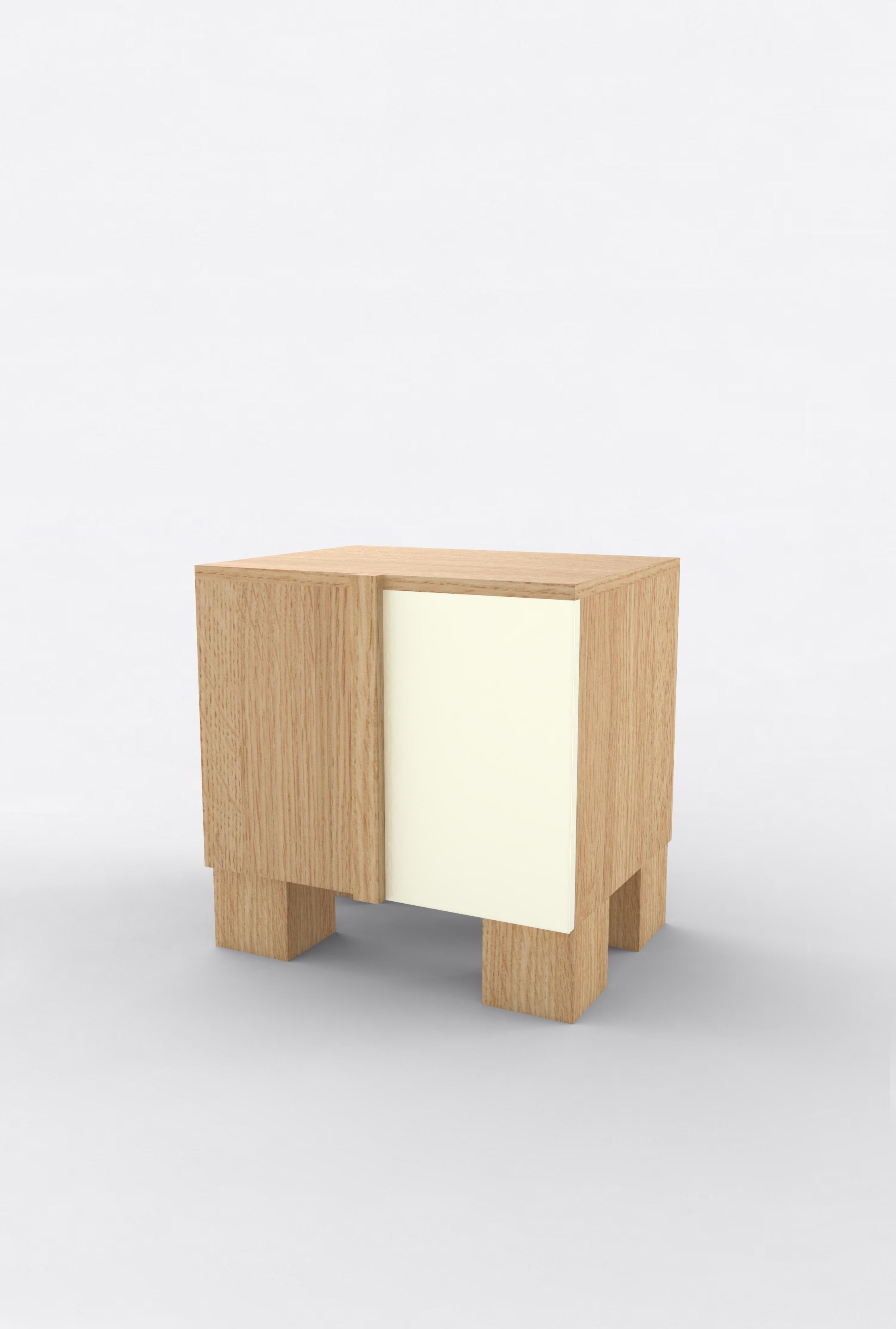 Orphan Work 100 Bedside
Shown in oak and white or off-white
Available in natural oak with painted door.
Measures: 24” W x 15” D x 22” H
2 doors with adjustable shelves. 

Orphan work is designed to complement in the heart of Soho, New York City.