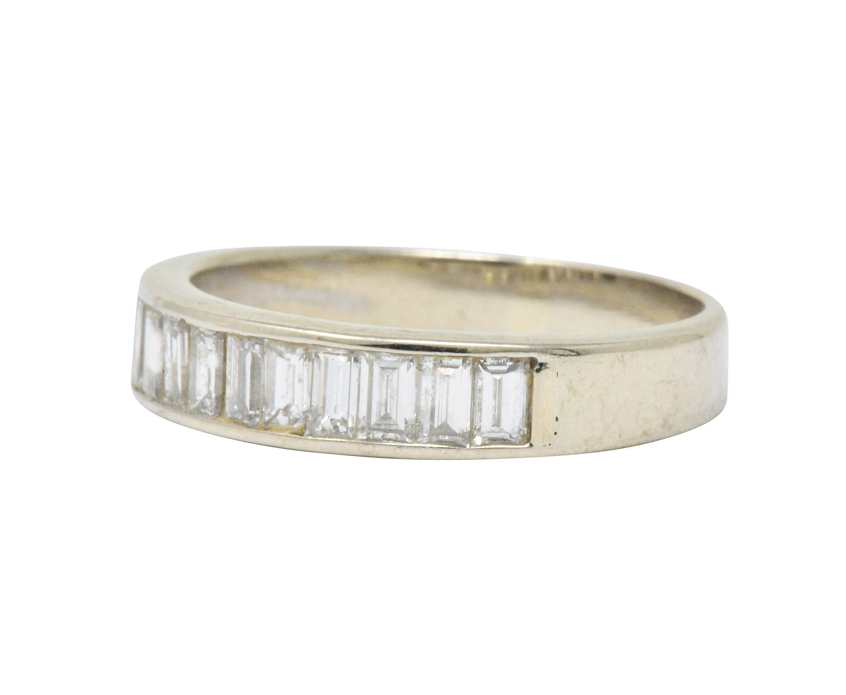 Band style ring channel set to front with baguette cut diamonds

Weighing approximately 1.00 carat total with G/H color and VS to SI clarity (mostly VS)

Tested as 14 karat white gold

Circa: 2000s

Ring size: 8 1/2 & sizable

Measures: 4.6 mm wide