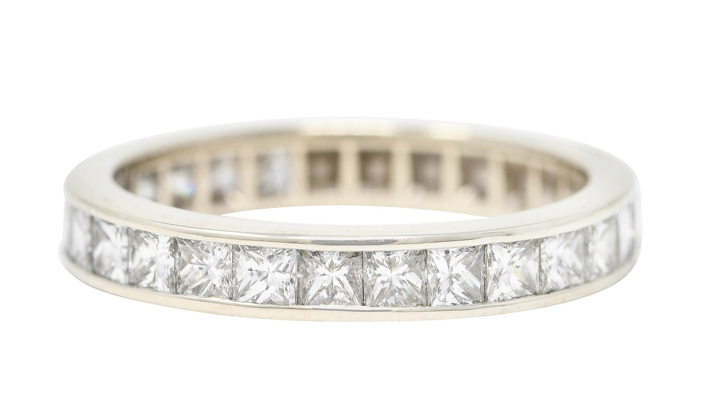 Band style ring channel set to front with princess cut diamonds

Weighing approximately 1.00 carat total - G to I in color with primarily VS clarity

Completed by high polished channel walls

Tested as 18 karat white gold

Circa: 2000's

Ring size: