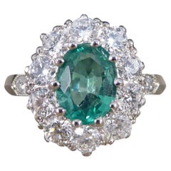 Contemporary 1.00ct Emerald and 0.95ct Diamond Cluster Ring in Platinum
