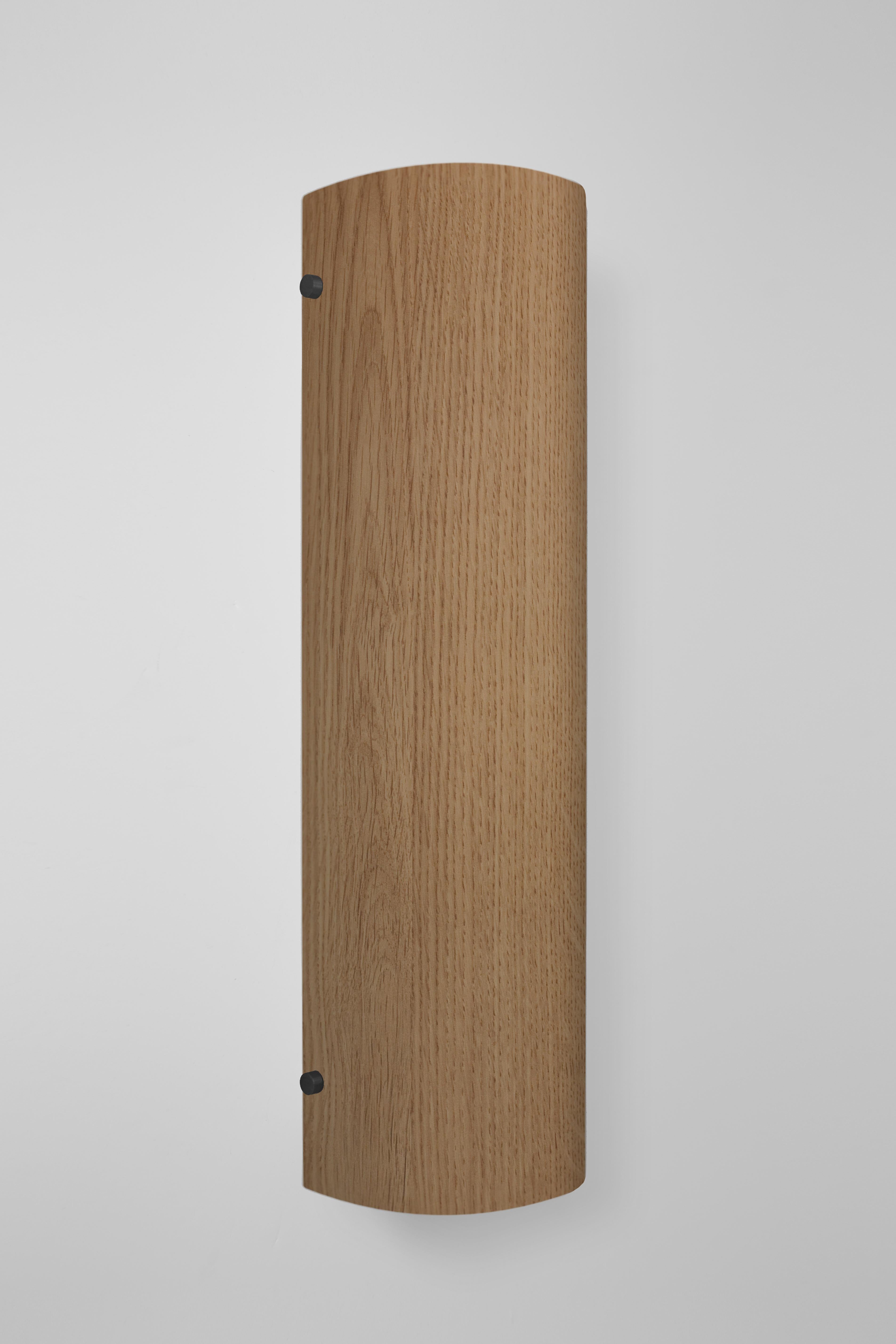 Orphan work 101W Sconce
Shown in oak with blackened brass. 
Available in natural oak brushed or blackened brass. 
Measures: 19”H x 4 3/4”W x 4 1/2”D
Wall or ceiling mount
Vertical or horizontal
Plug-in by request
UL approved
Holds (2) 60W candelabra