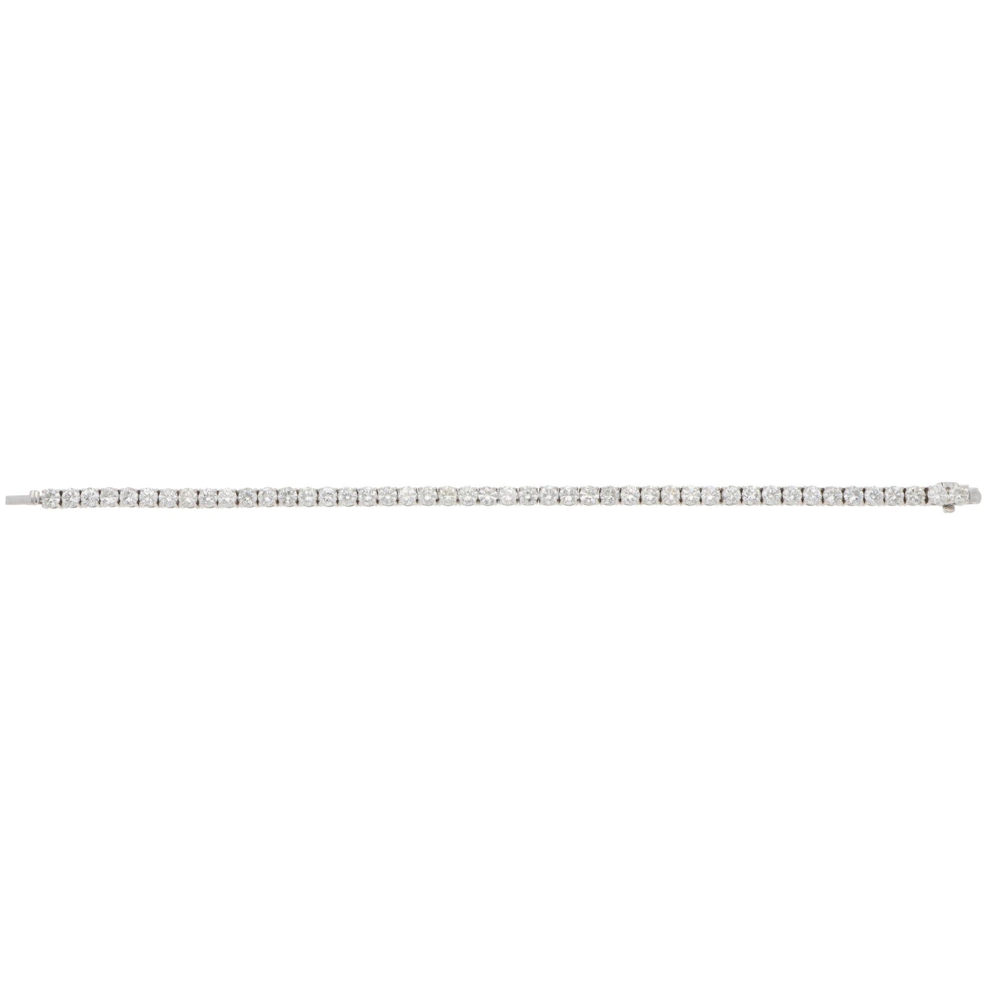 A beautiful contemporary diamond line tennis bracelet set in 14k white gold.

The bracelet is composed of a grand total of 46 round brilliant-cut diamonds. All stones are securely four-prong set and perfectly matched in size. The bracelet is secured