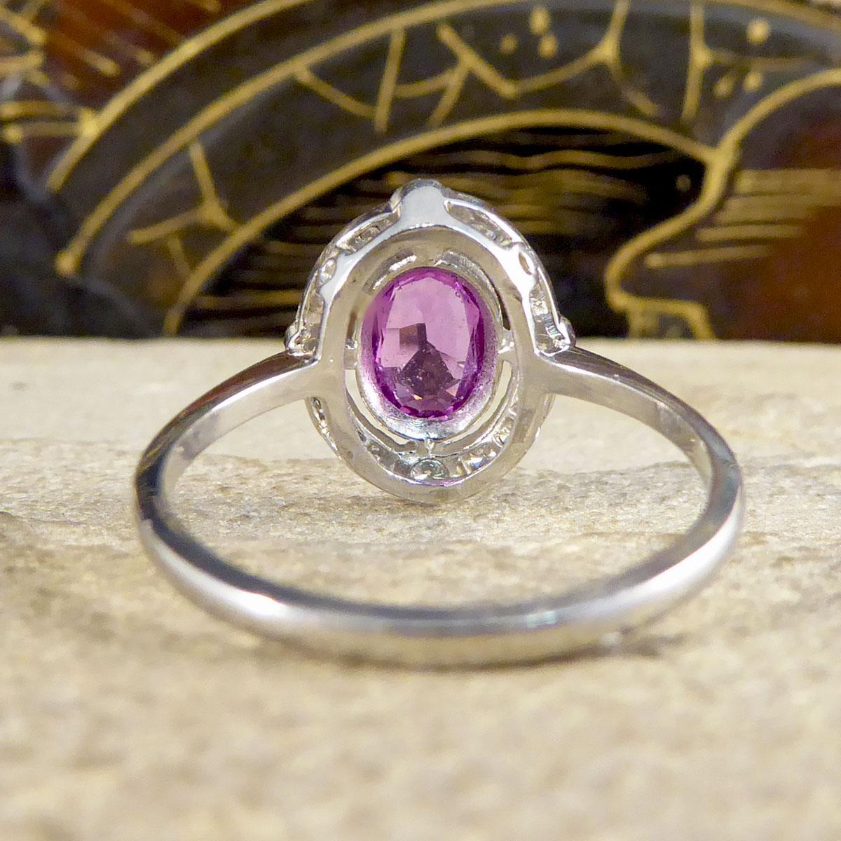 Oval Cut Contemporary 1.05ct Pink Sapphire and Diamond Halo Ring Mounted in Platinum For Sale