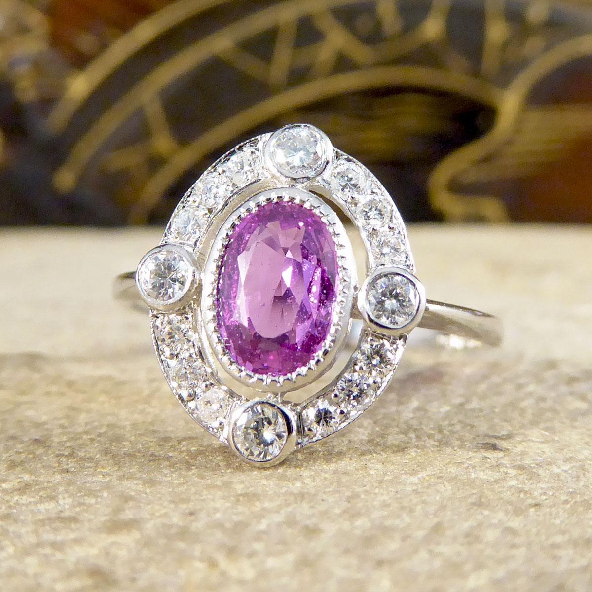 Contemporary 1.05ct Pink Sapphire and Diamond Halo Ring Mounted in Platinum In Good Condition For Sale In Yorkshire, West Yorkshire