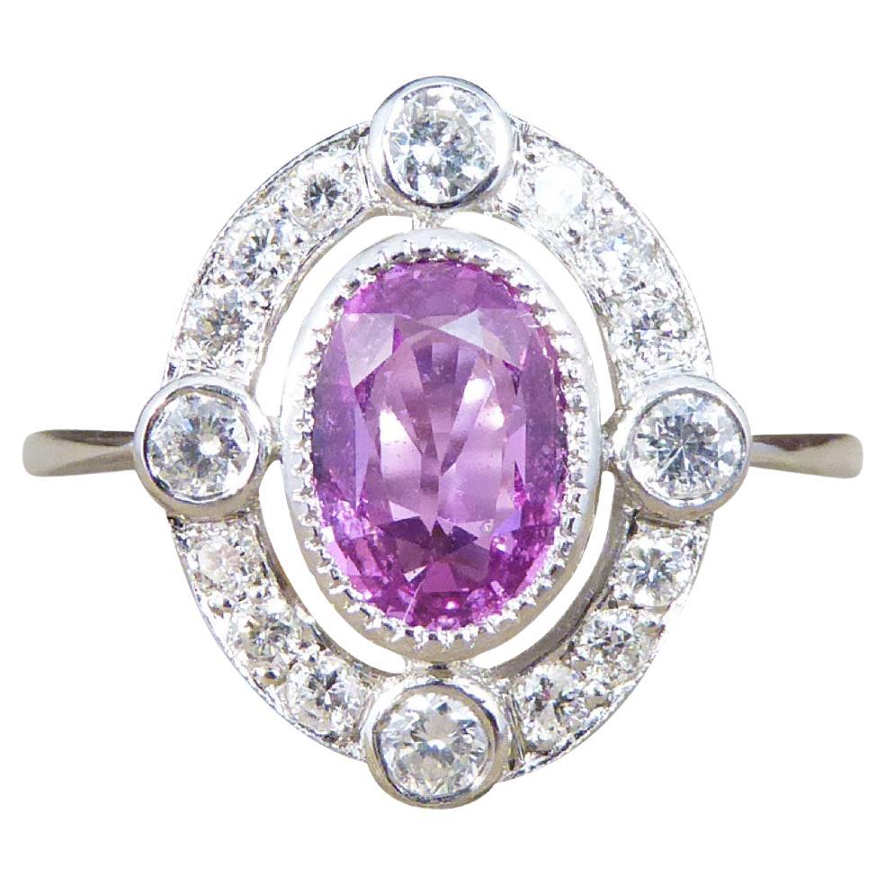 Contemporary 1.05ct Pink Sapphire and Diamond Halo Ring Mounted in Platinum For Sale
