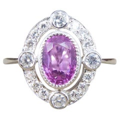 Contemporary 1.05ct Pink Sapphire and Diamond Halo Ring Mounted in Platinum