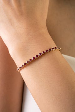 Contemporary 1.16 Ct Bezel Set Round Ruby Tennis Bracelet in 18k Yellow Gold