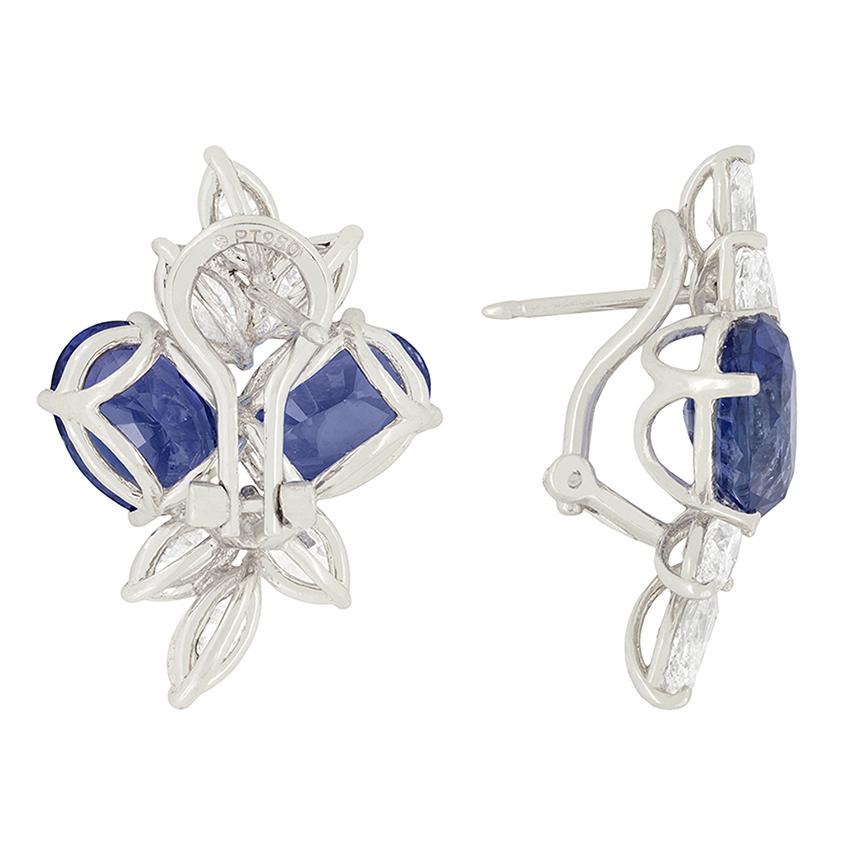 These sensational earrings feature two oval sapphires on each ear, complemented with sparkling marquise cut diamonds. Totalling 12.32 carat across each ear, these gorgeous sapphires are natural and unheated.  The marquise cut diamonds are set three