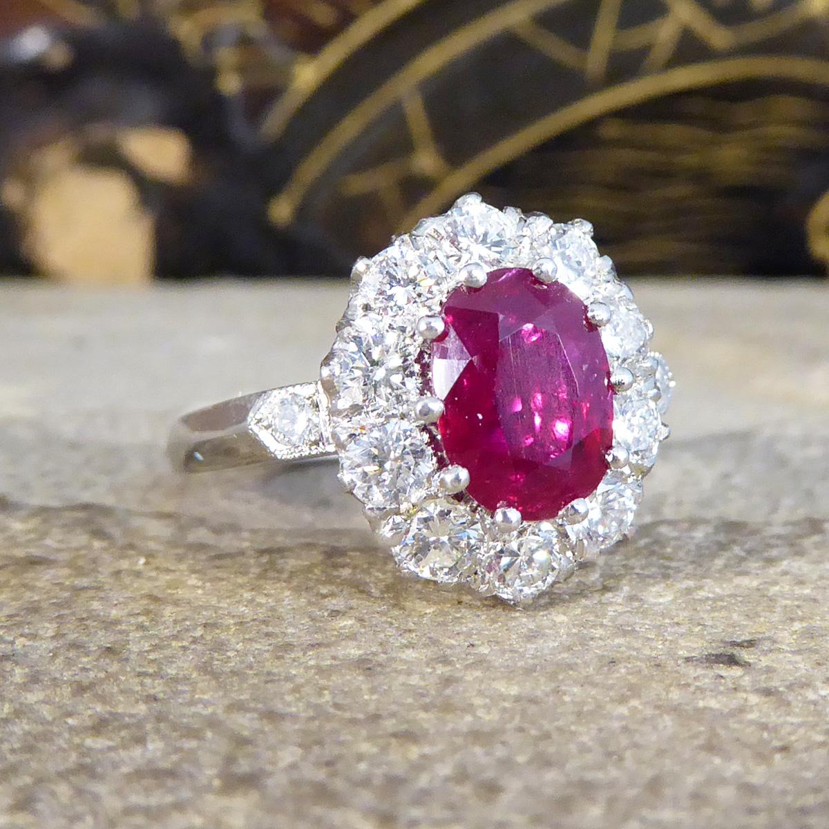 This contemporary ring has been crafted with a 1.28ct stunning deep red Ruby in the centre with a surround of 10 Brilliant Cut Diamonds weighing a total of 0.95ct. The Ruby itself has a deep red colour to it with brighter reds and pinks coming out