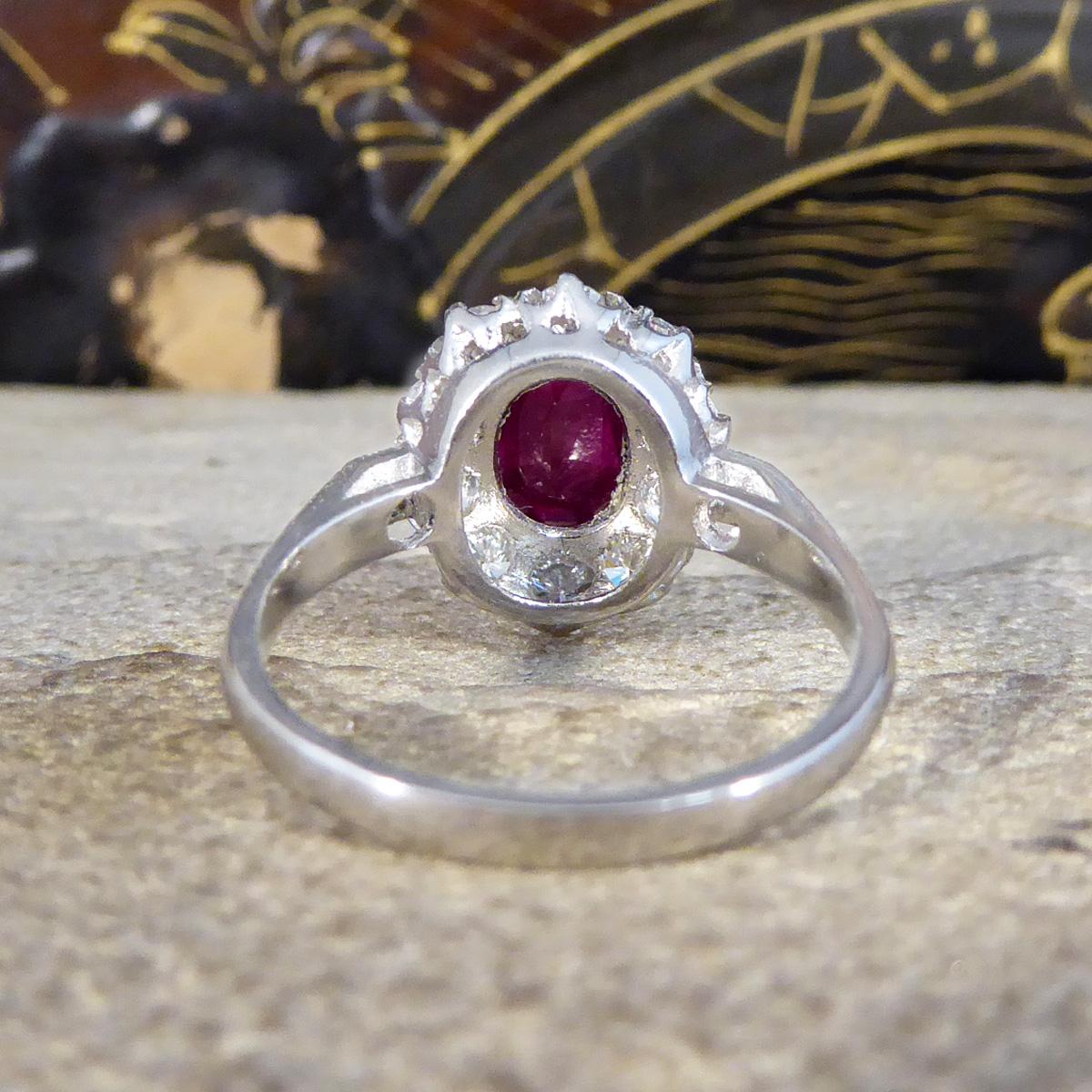 Oval Cut Contemporary 1.28ct Ruby and 0.95ct Diamond Cluster Ring in Platinum For Sale