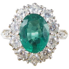 Contemporary 1.30 Carat Emerald and 2.15 Carat Diamond Cluster Ring in Platinum