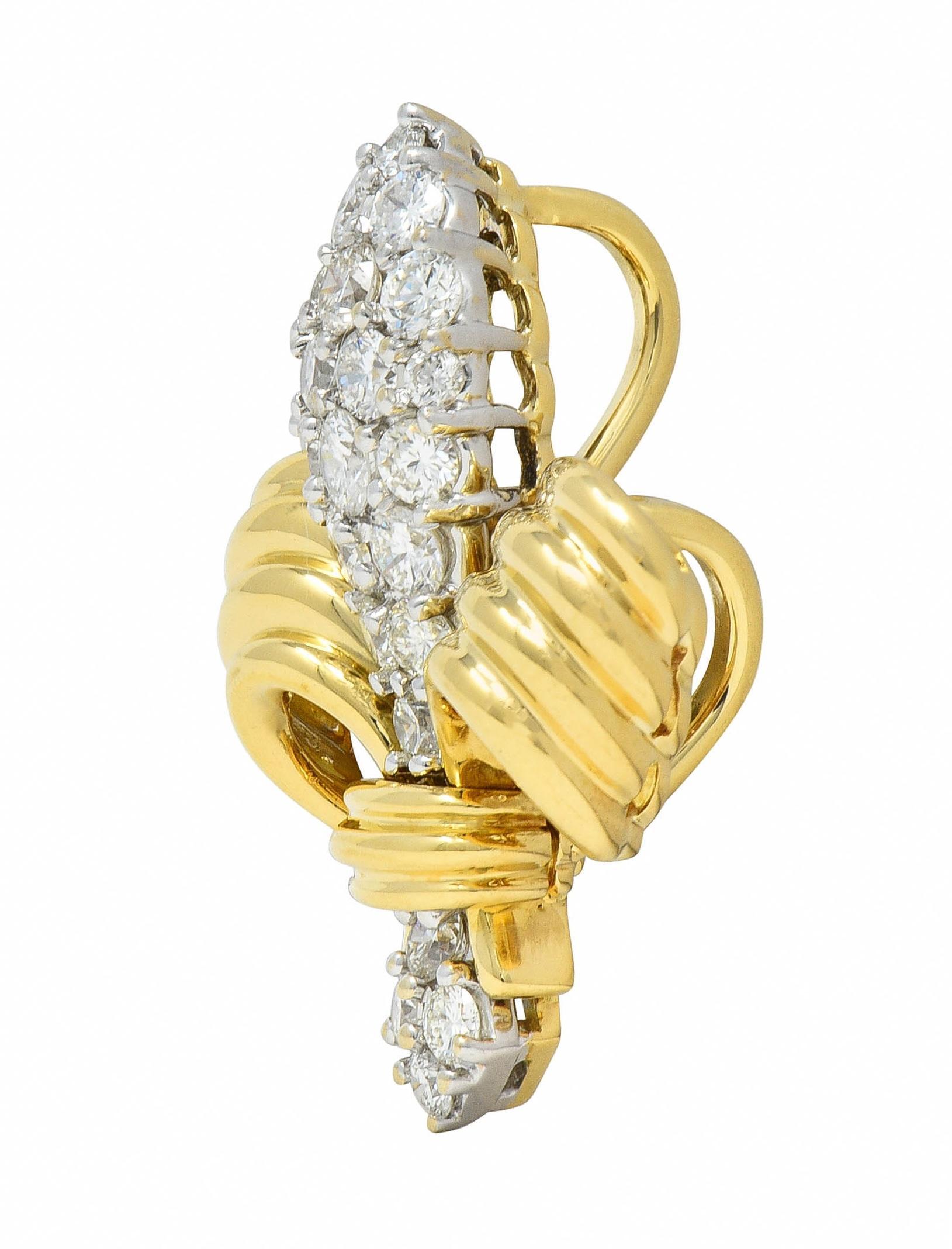 Designed as a dimensional fleur-de-lis form with fluted detail
Featuring round brilliant cut diamonds in middle section
Weighing approximately 1.30 carats - G/H color with VS2 clarity
Pavé set in white gold
With high polish finish
Complete by three