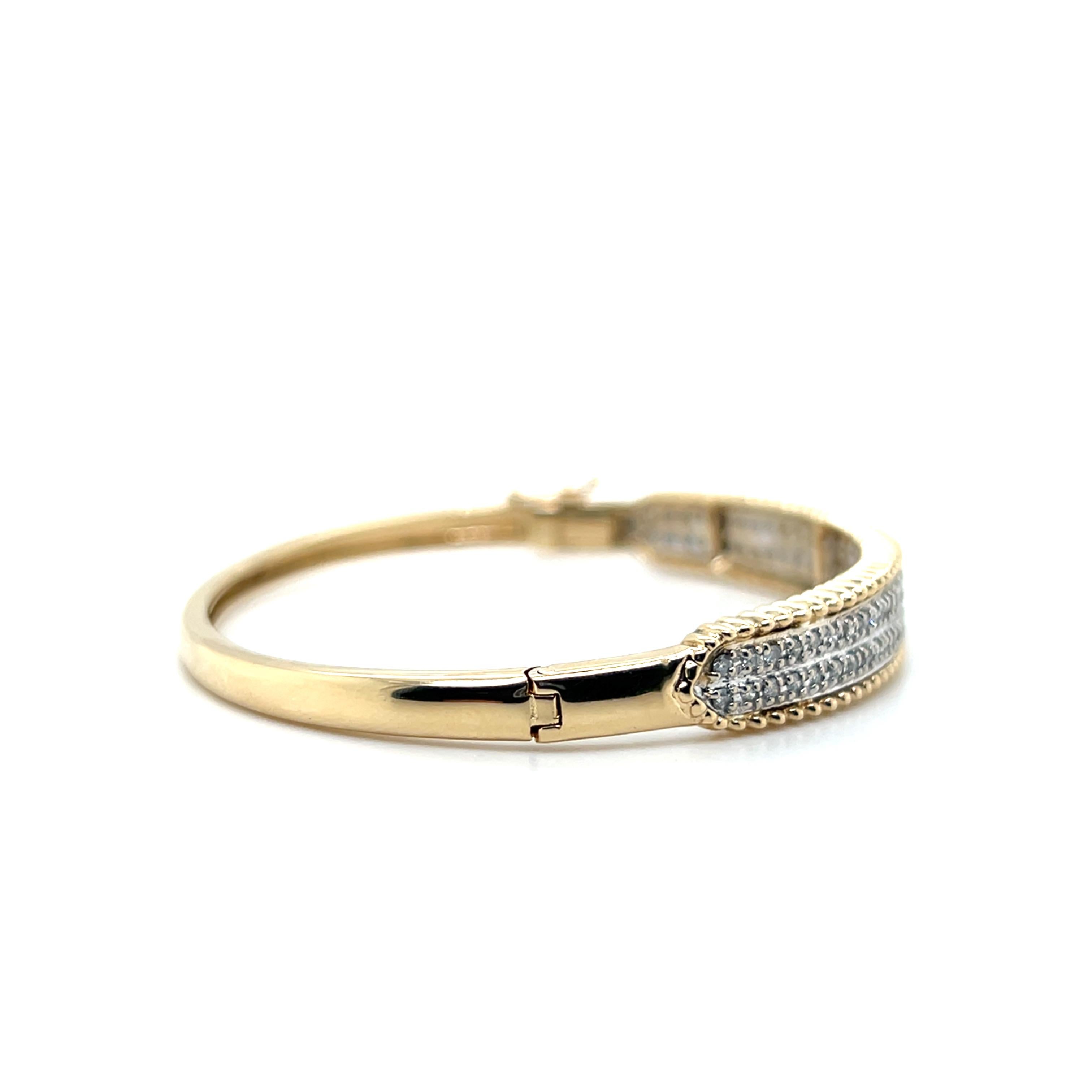 Contemporary 1.32 TCW Diamond 14k Yellow and White Gold Hinged Bangle Bracelet For Sale 3