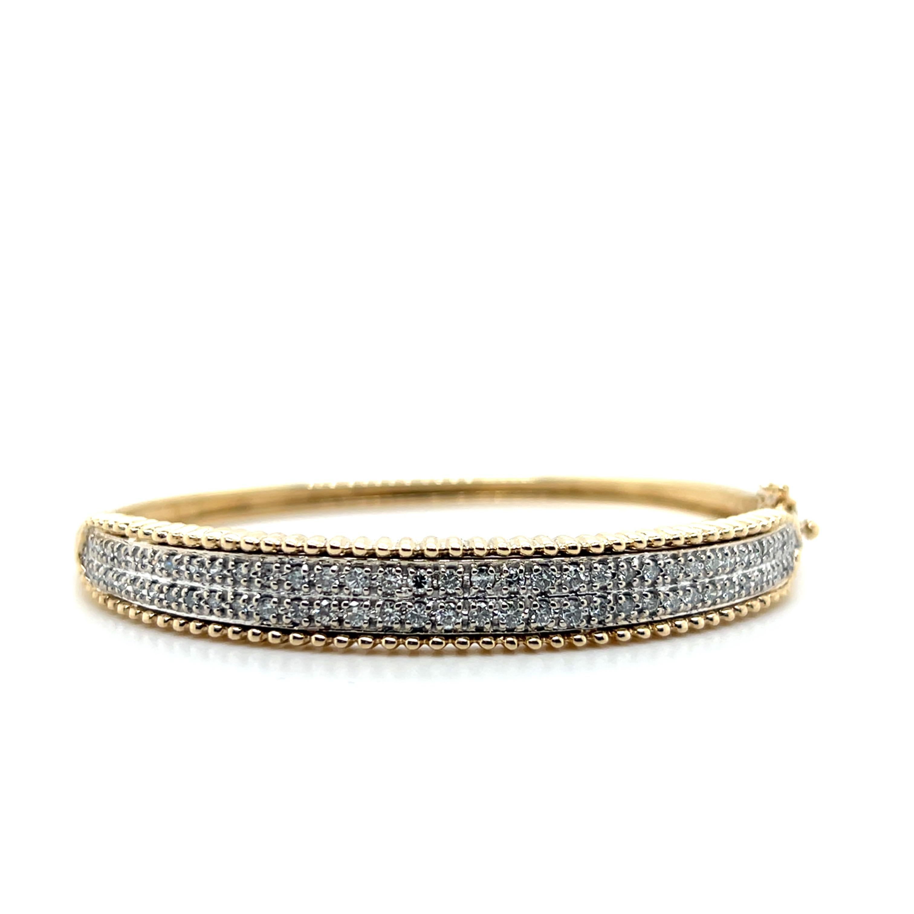 Contemporary 1.32 TCW Diamond 14k Yellow and White Gold Hinged Bangle Bracelet For Sale